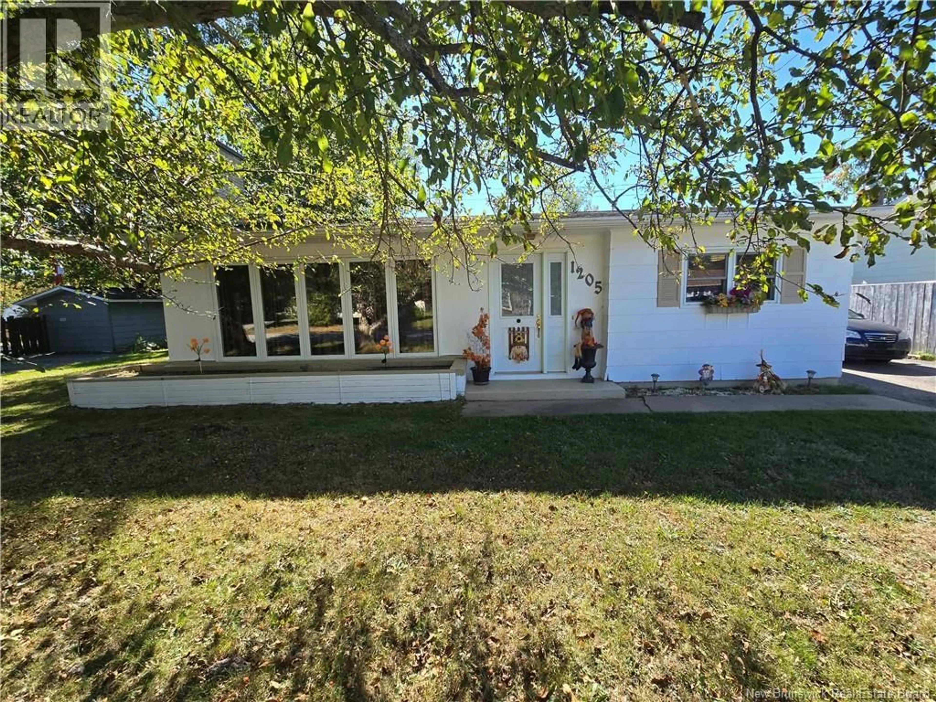 A pic from outside/outdoor area/front of a property/back of a property/a pic from drone, street for 1205 CENTENNIAL STREET, Bathurst New Brunswick E2A4A9