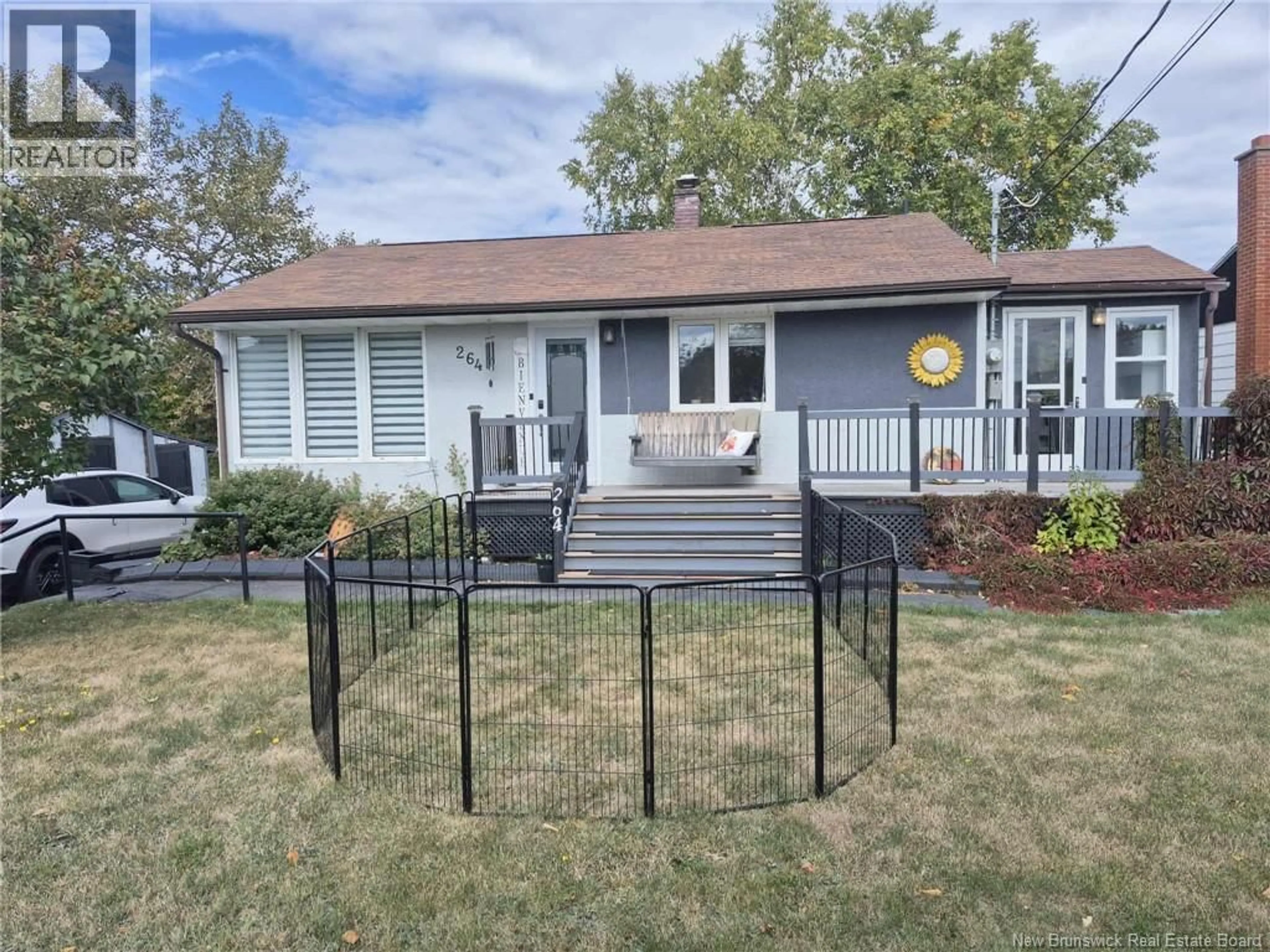 Home with vinyl exterior material, street for 264 RUE MARIE, Beresford New Brunswick E8K1P8