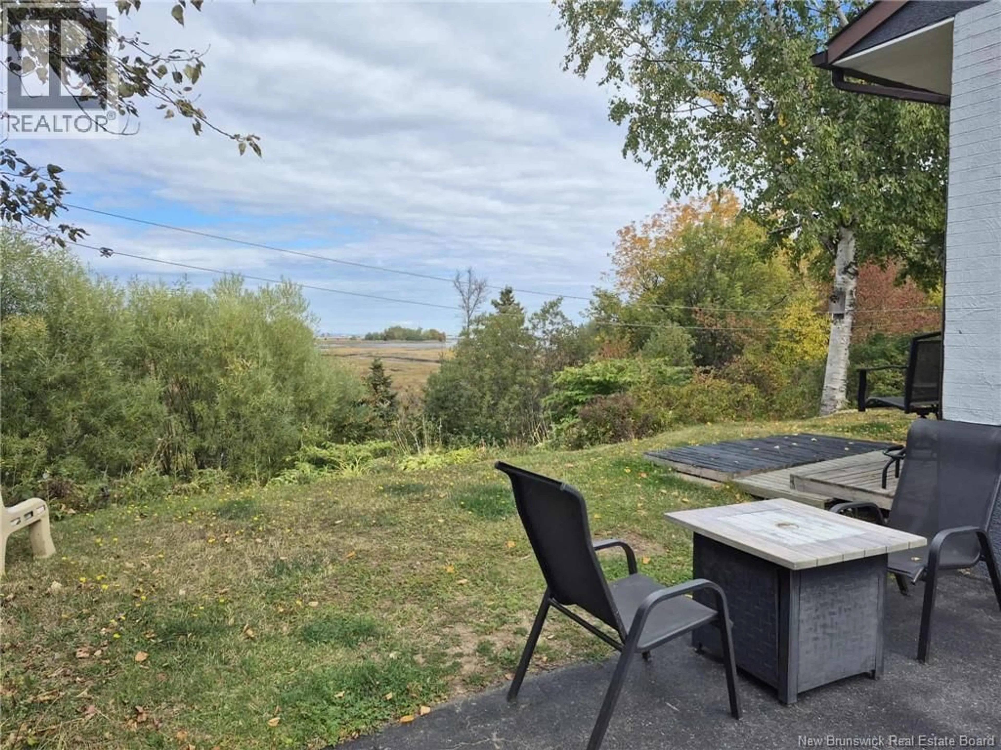 A pic from outside/outdoor area/front of a property/back of a property/a pic from drone, unknown for 264 RUE MARIE, Beresford New Brunswick E8K1P8