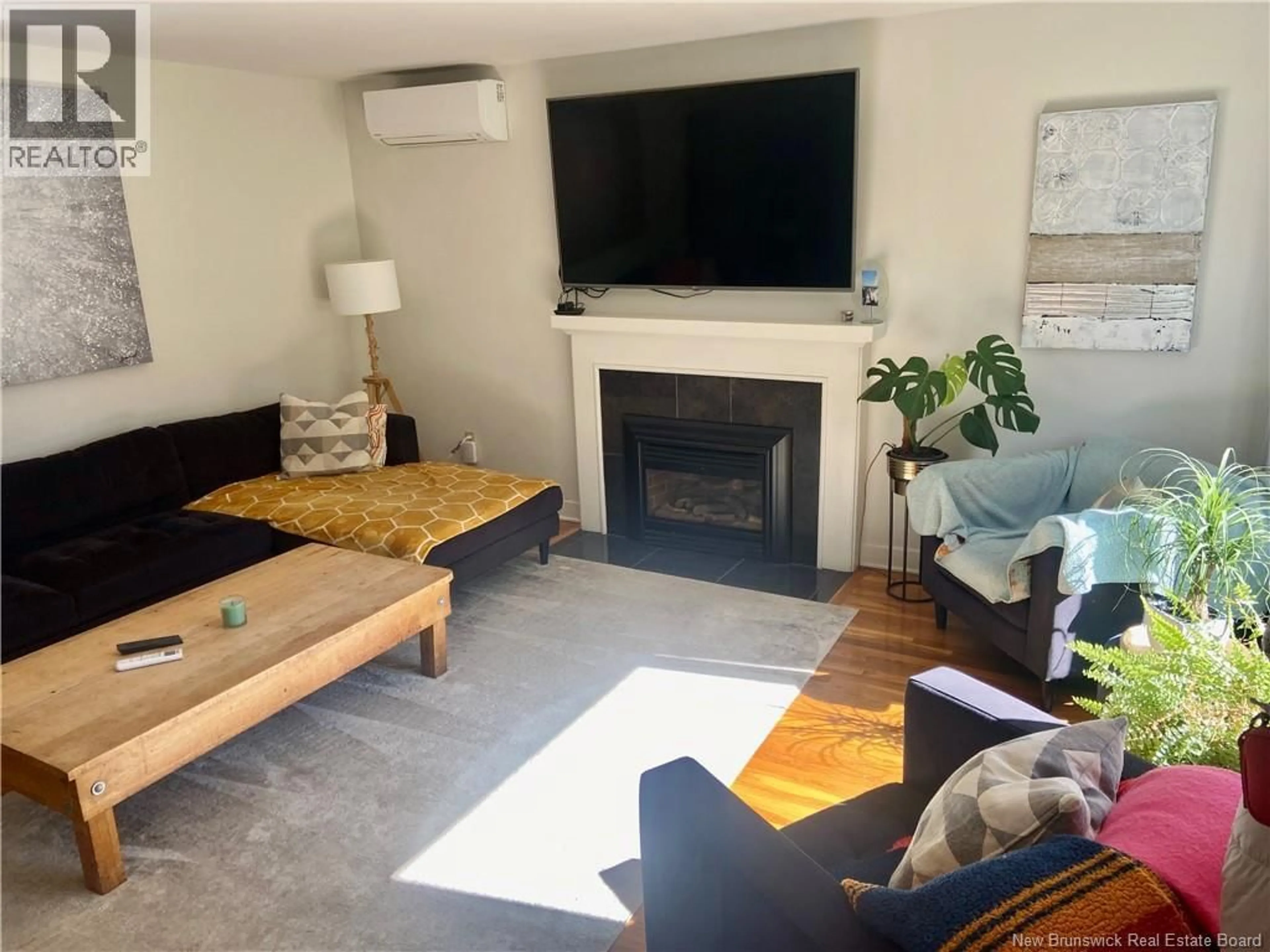 Living room with furniture, wood/laminate floor for 21 BROADWAY STREET, Rothesay New Brunswick E2H1B3