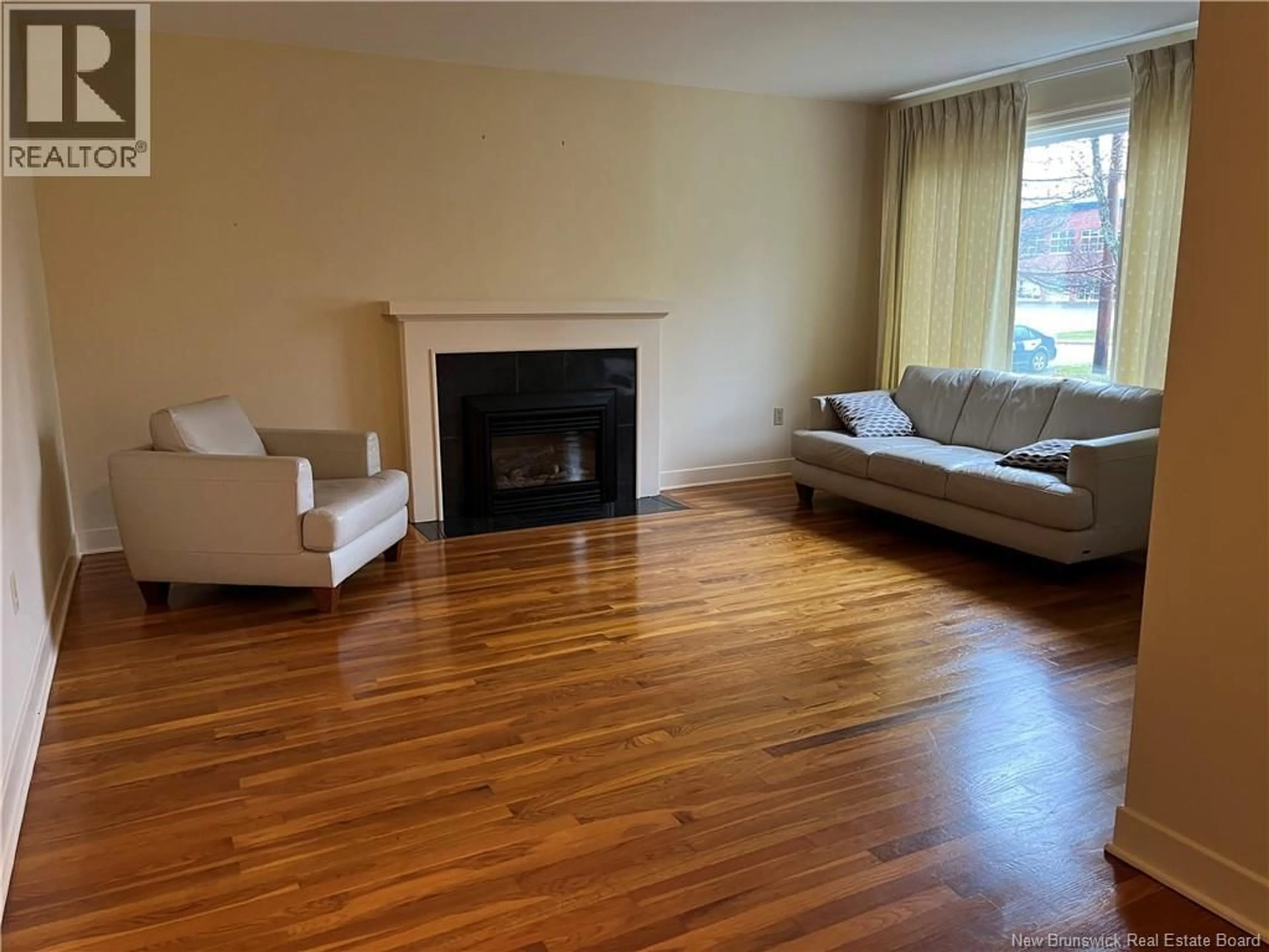 Living room with furniture, wood/laminate floor for 21 BROADWAY STREET, Rothesay New Brunswick E2H1B3