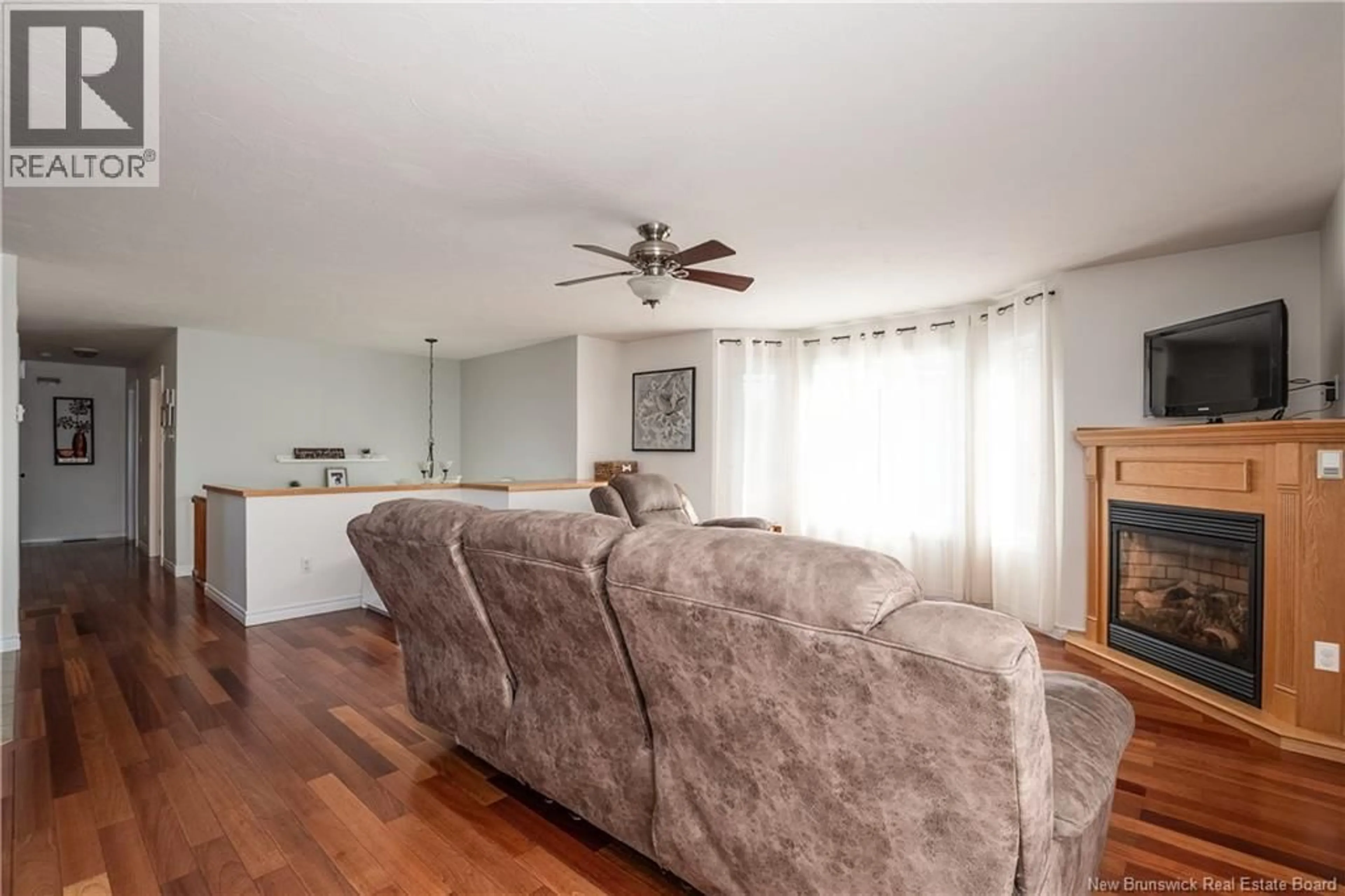 Living room with furniture, wood/laminate floor for 15 RITCHIE ROAD, Upper Coverdale New Brunswick E4J1V2