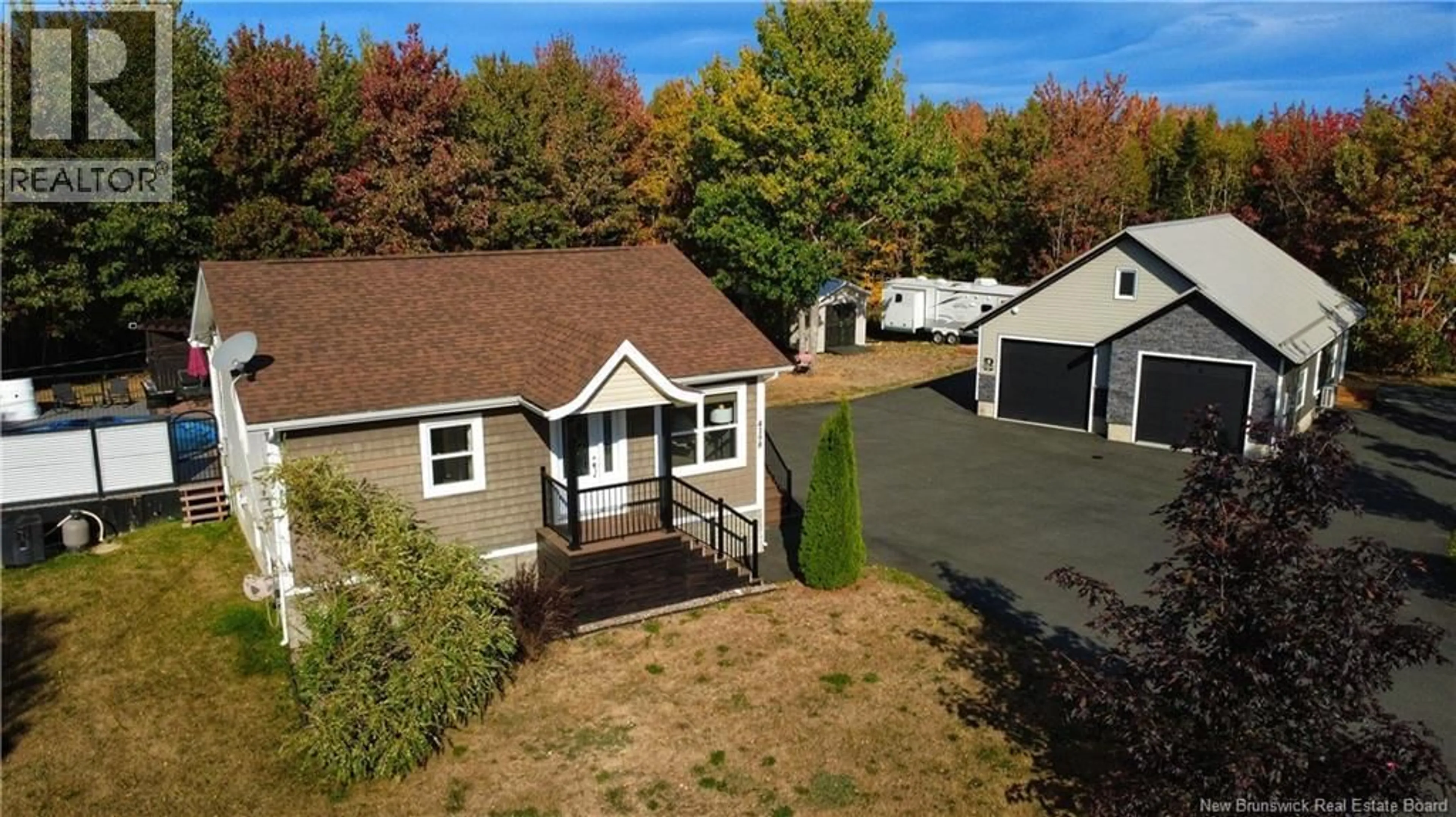 A pic from outside/outdoor area/front of a property/back of a property/a pic from drone, street for 4198 RUE ROBINSON, Tracadie New Brunswick E1X1C1