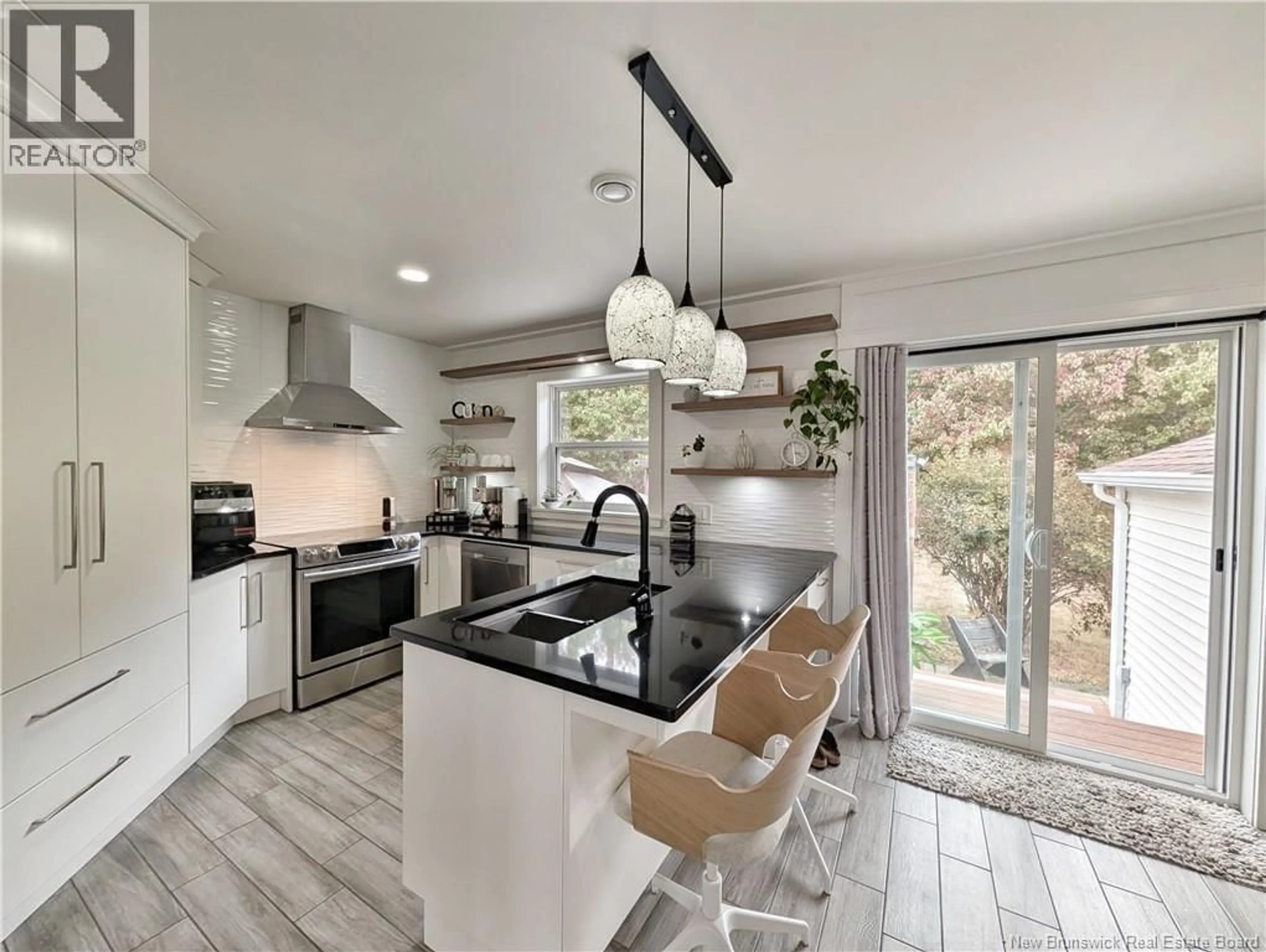 Open concept kitchen, ceramic/tile floor for 4198 RUE ROBINSON, Tracadie New Brunswick E1X1C1