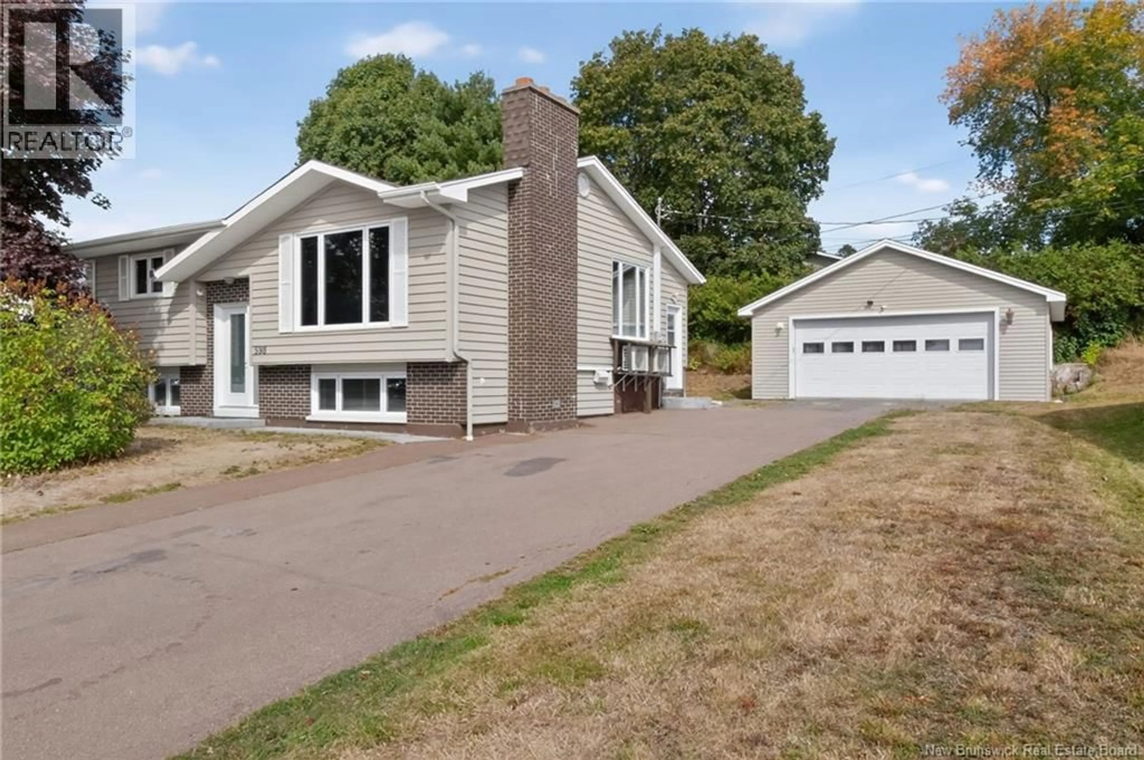 Home with vinyl exterior material, street for 598 GUY, Dieppe New Brunswick E1A4V7