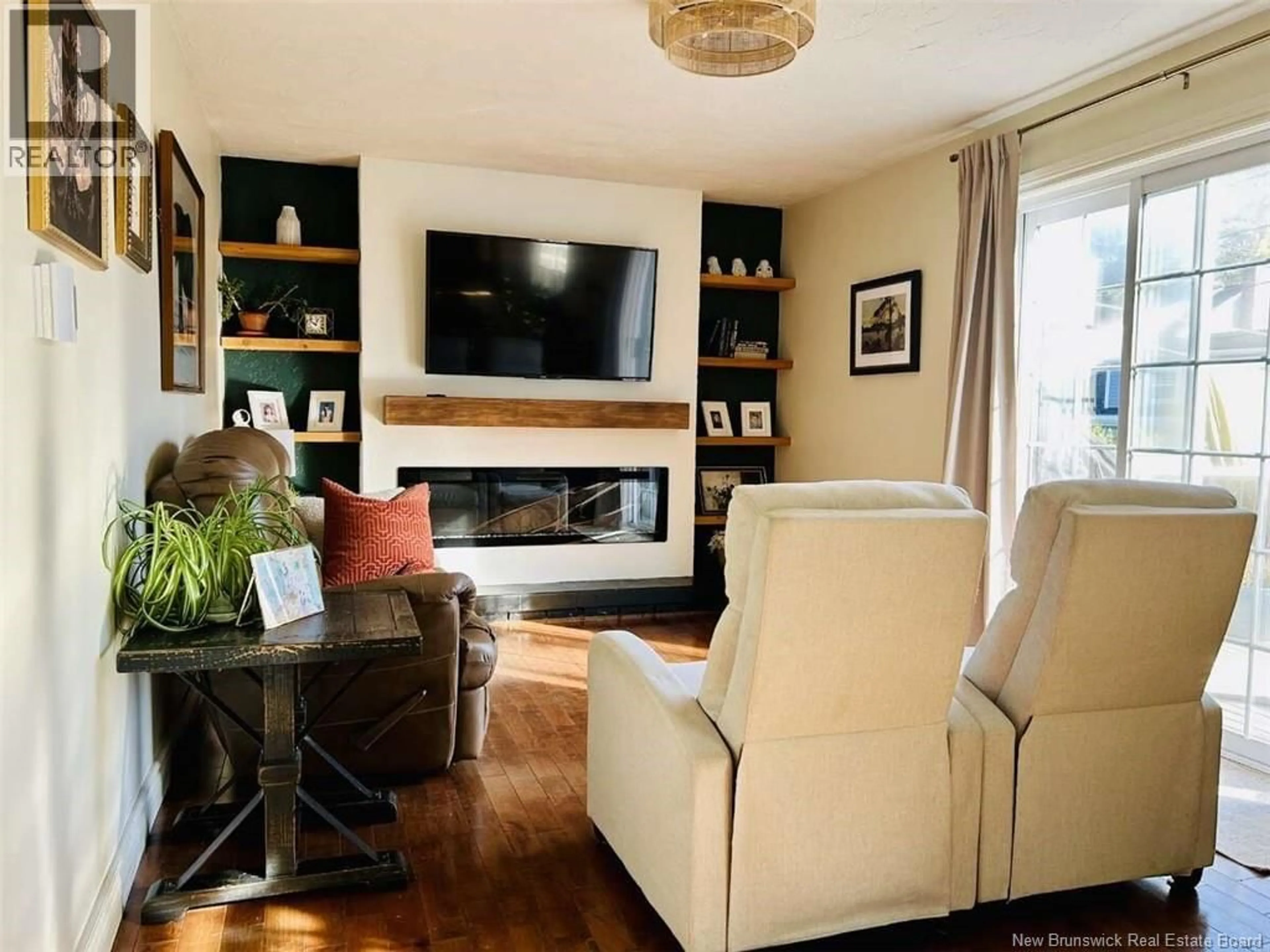 Living room with furniture, wood/laminate floor for 197 CENTENNIAL DRIVE, Moncton New Brunswick E1E3W9