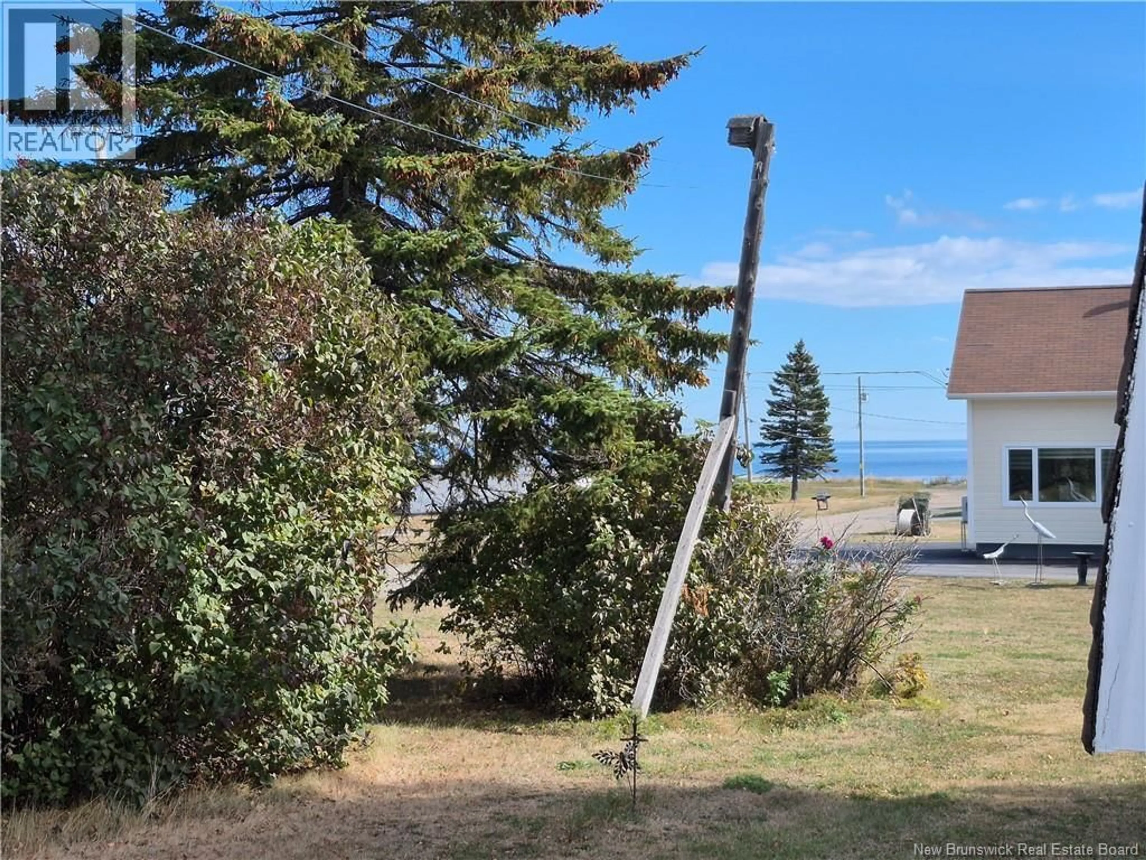 A pic from outside/outdoor area/front of a property/back of a property/a pic from drone, water/lake/river/ocean view for 1109 ROUTE 134, Petit-Rocher-Sud New Brunswick E8J1C4