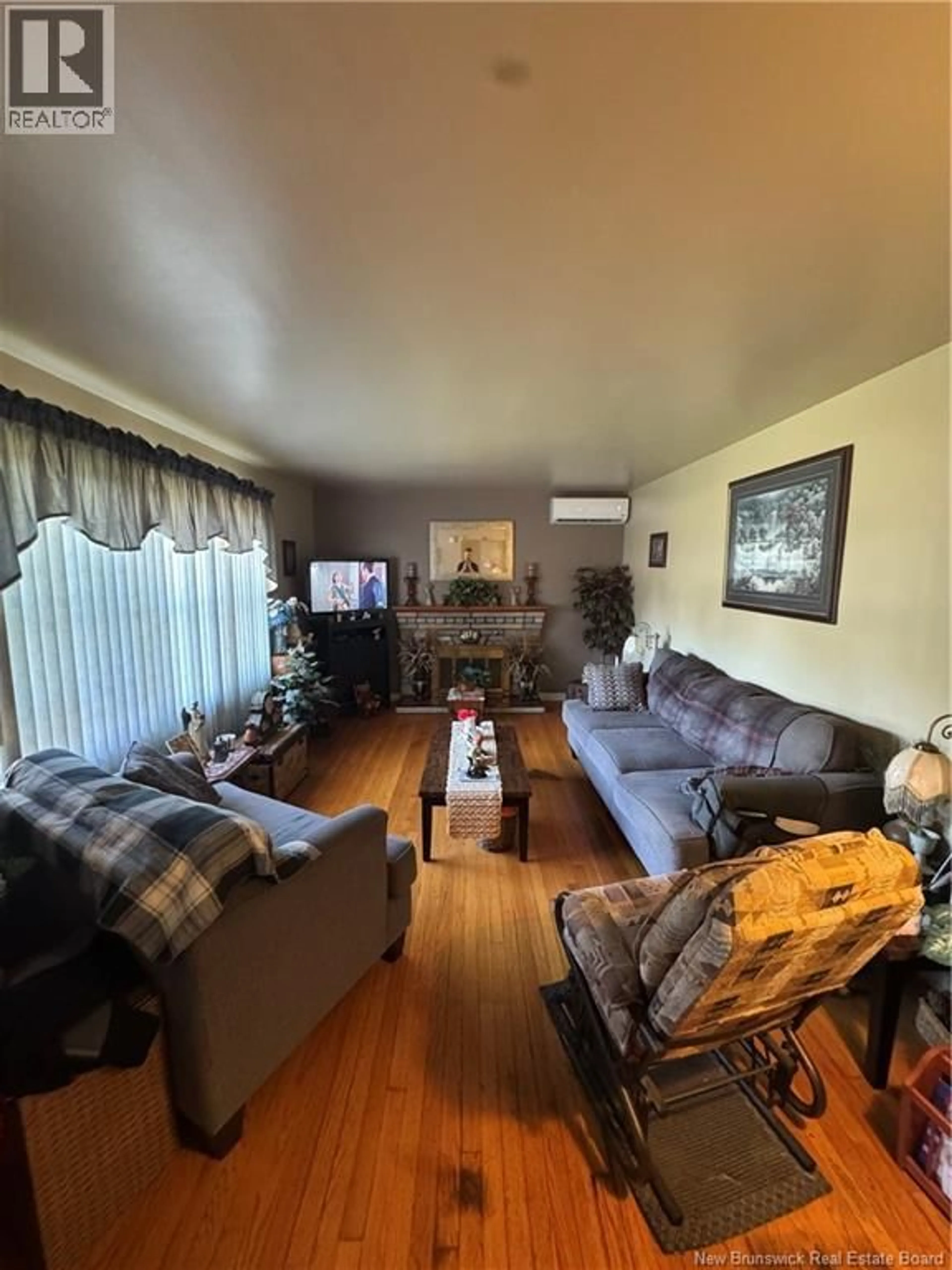 Living room with furniture, wood/laminate floor for 38 VINE AVENUE, Moncton New Brunswick E1E1K1