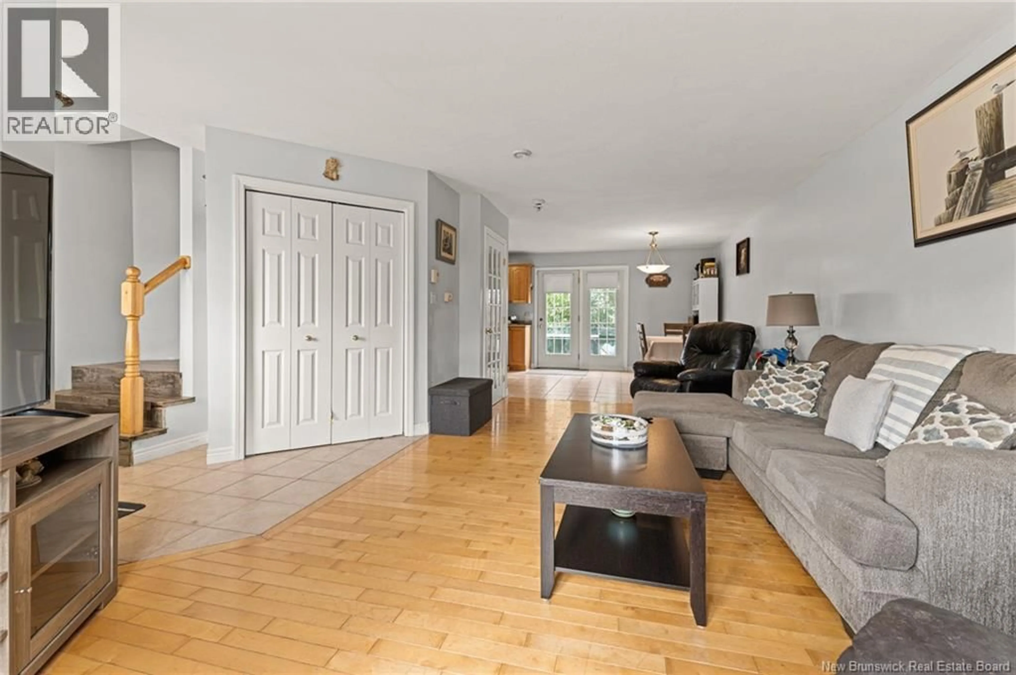 Living room with furniture, wood/laminate floor for 135 RENNICK, Moncton New Brunswick E1G4X2