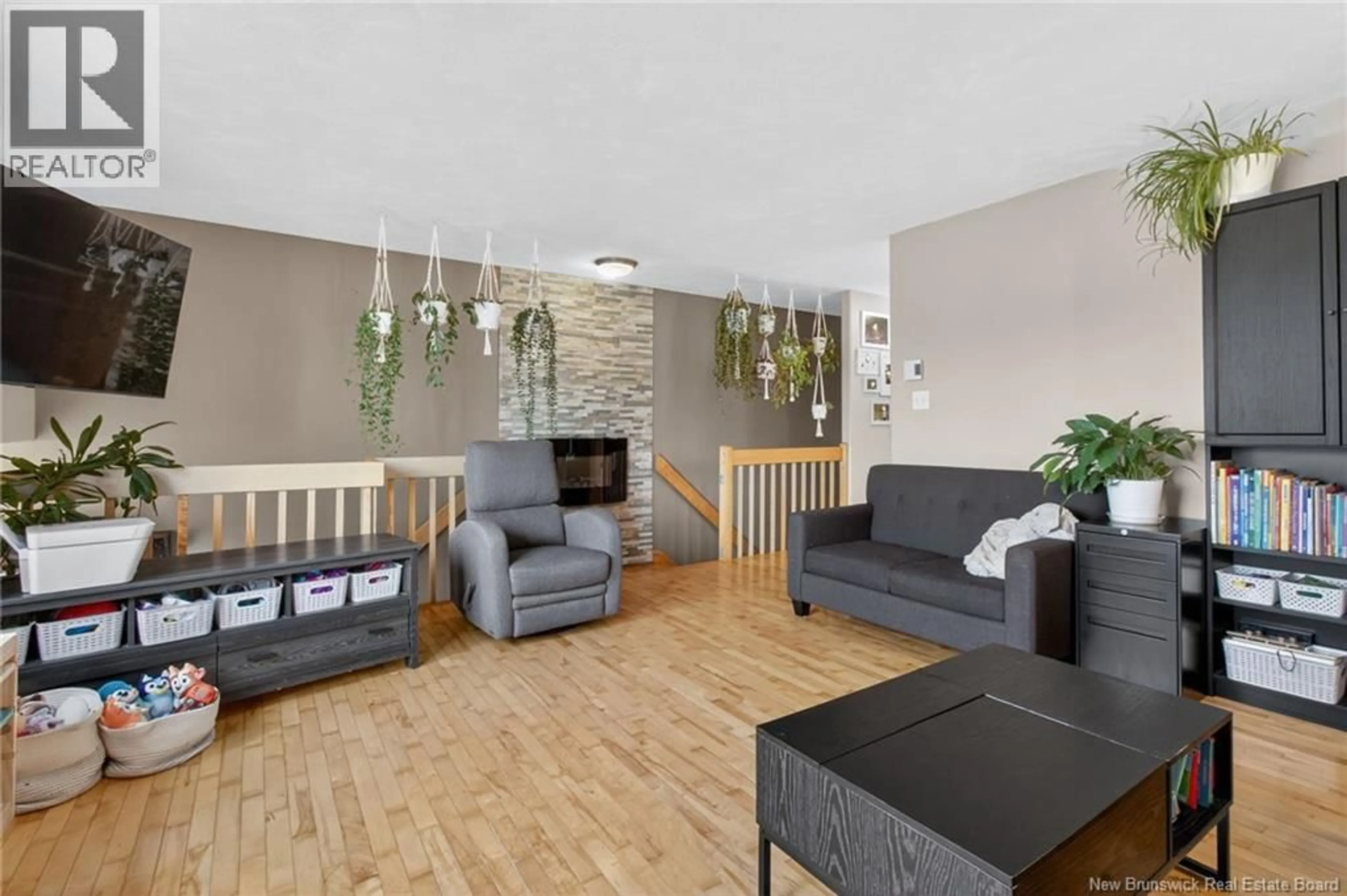Living room with furniture, wood/laminate floor for 17 DANUBE COURT, Dieppe New Brunswick E1A8G6