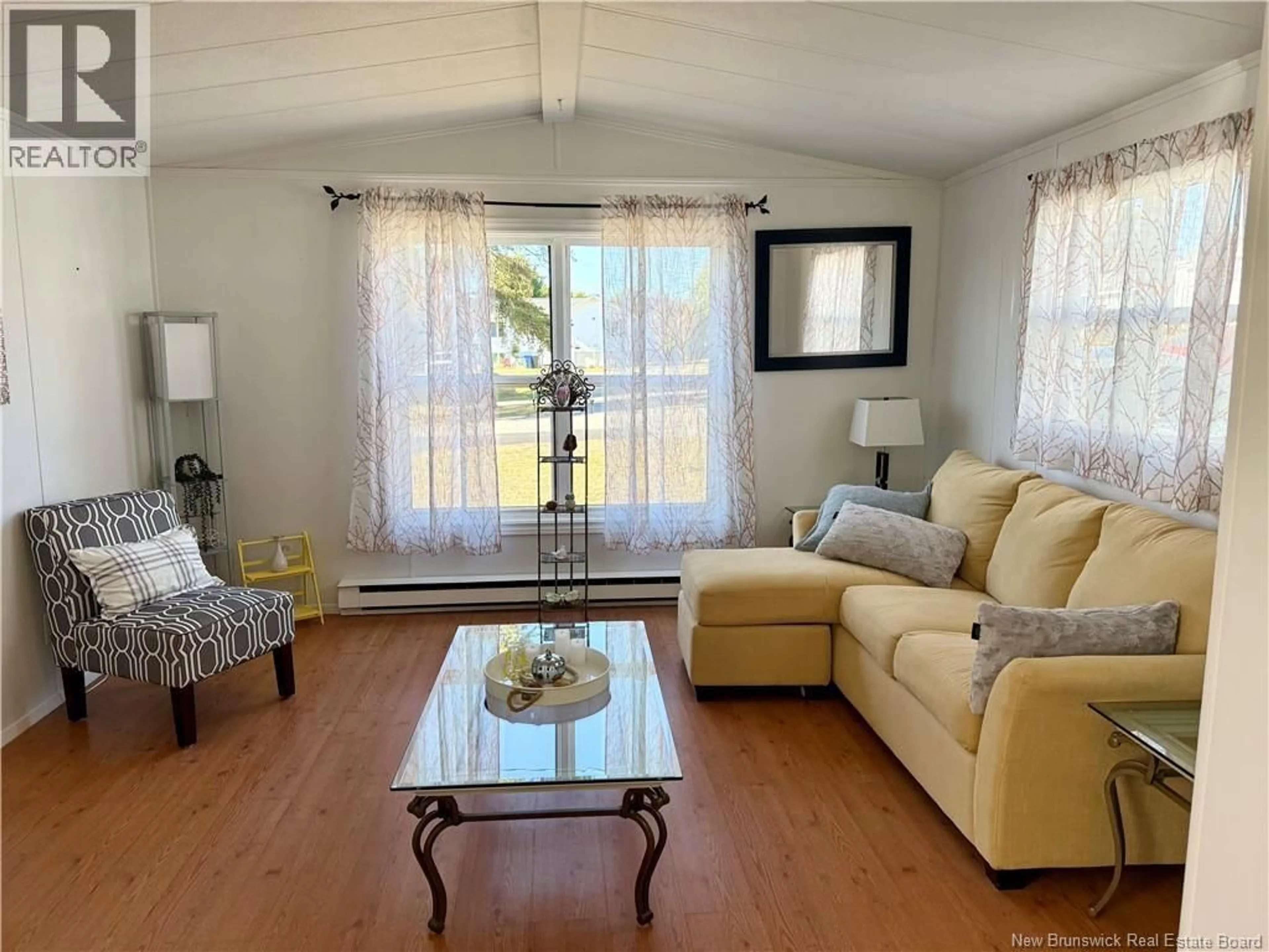 Living room with furniture, wood/laminate floor for 462 SUNNYSIDE AVENUE, Miramichi New Brunswick E1V5N5