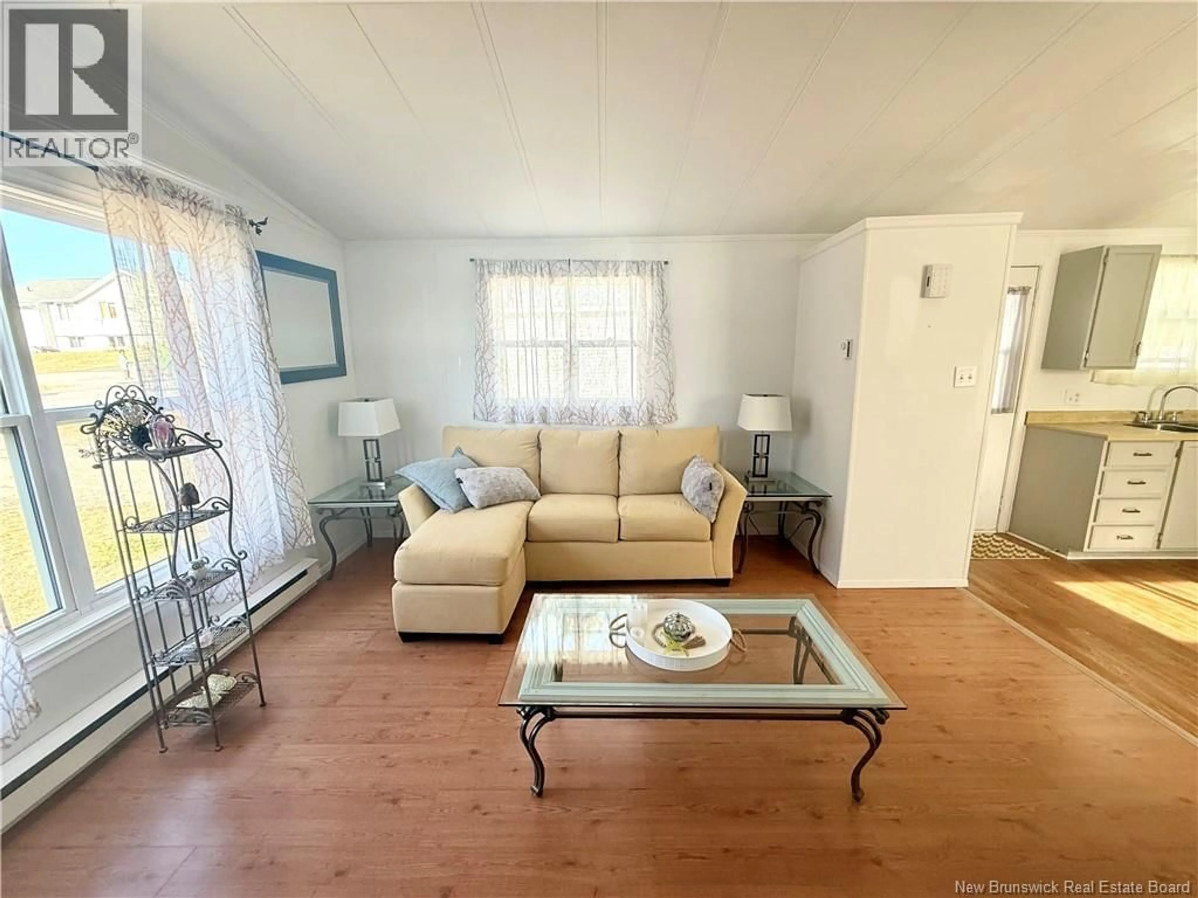Living room with furniture, wood/laminate floor for 462 SUNNYSIDE AVENUE, Miramichi New Brunswick E1V5N5