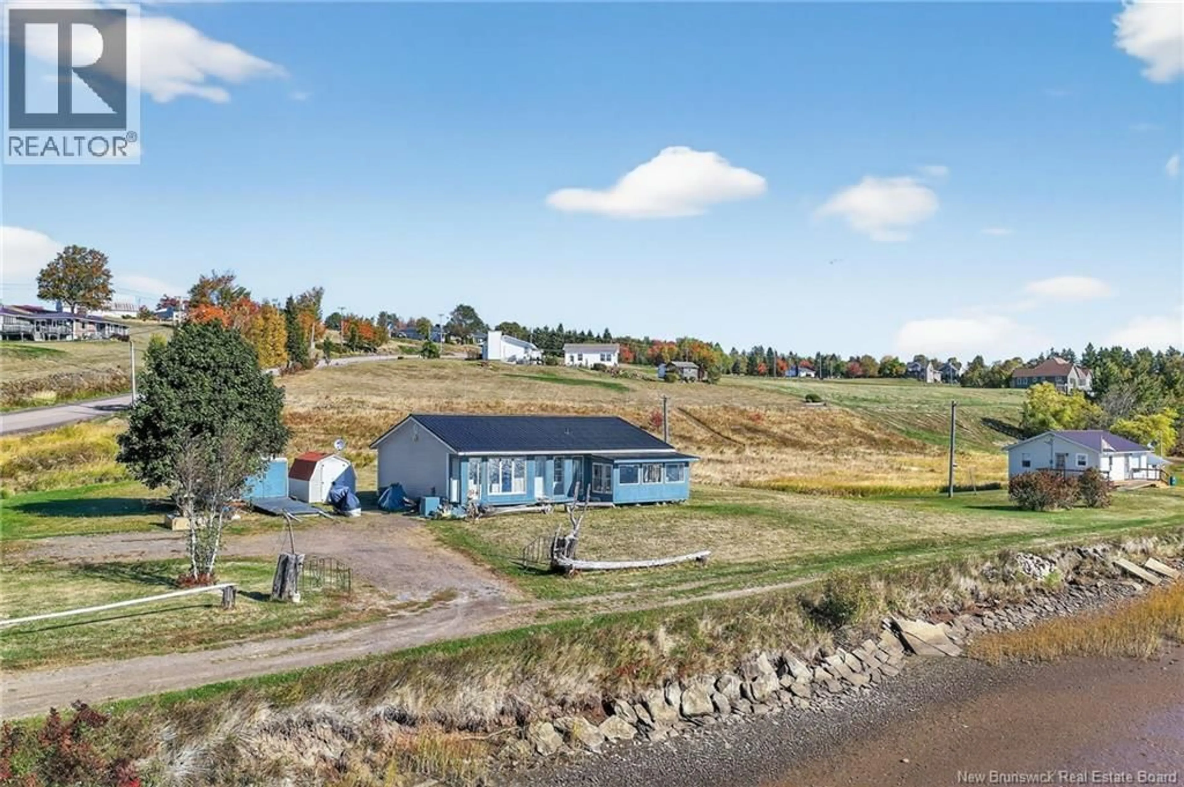 A pic from outside/outdoor area/front of a property/back of a property/a pic from drone, water/lake/river/ocean view for 11411 ROUTE 515, Bouctouche Cove New Brunswick E4S4J5