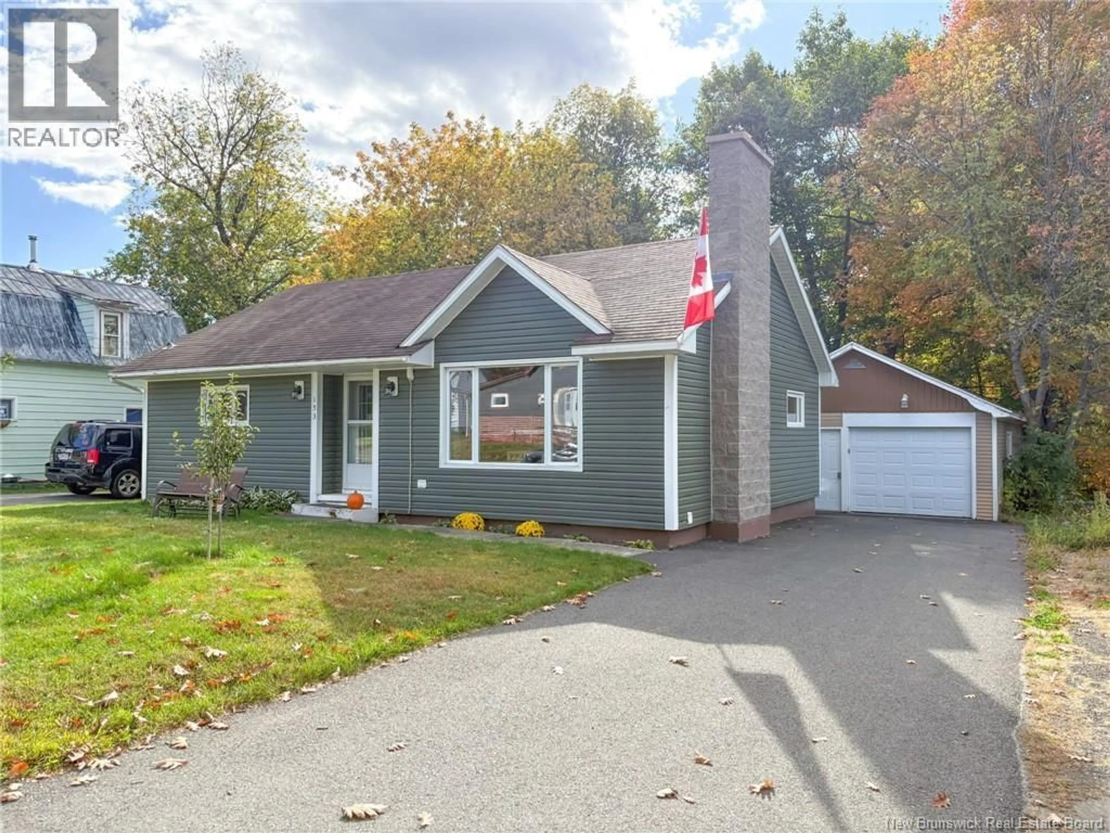 Home with vinyl exterior material, street for 153 ELM STREET, Woodstock New Brunswick E7M1R7