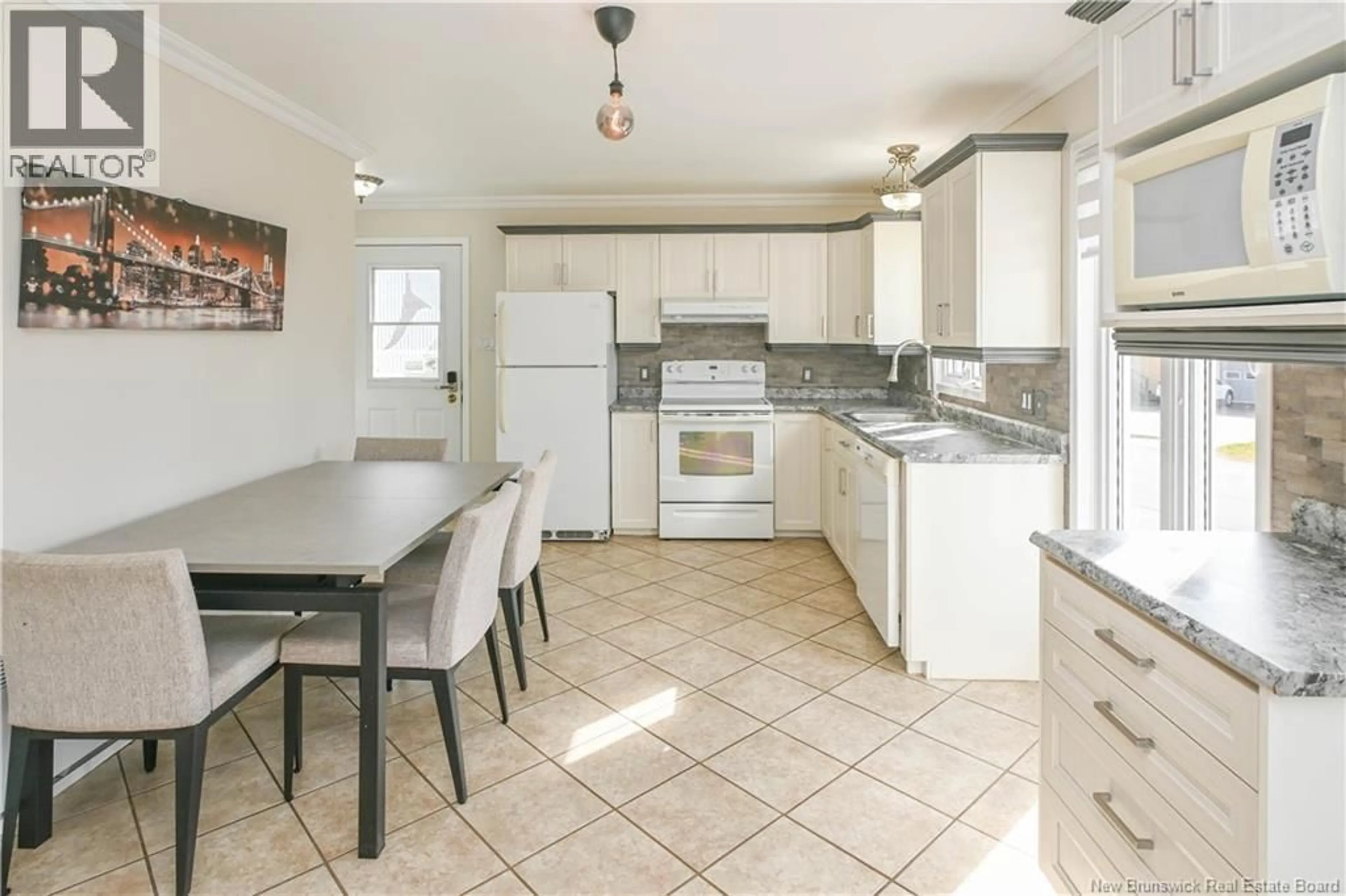 Open concept kitchen, ceramic/tile floor for 549 RUE SUZANNE STREET, Tracadie New Brunswick E1X1B5