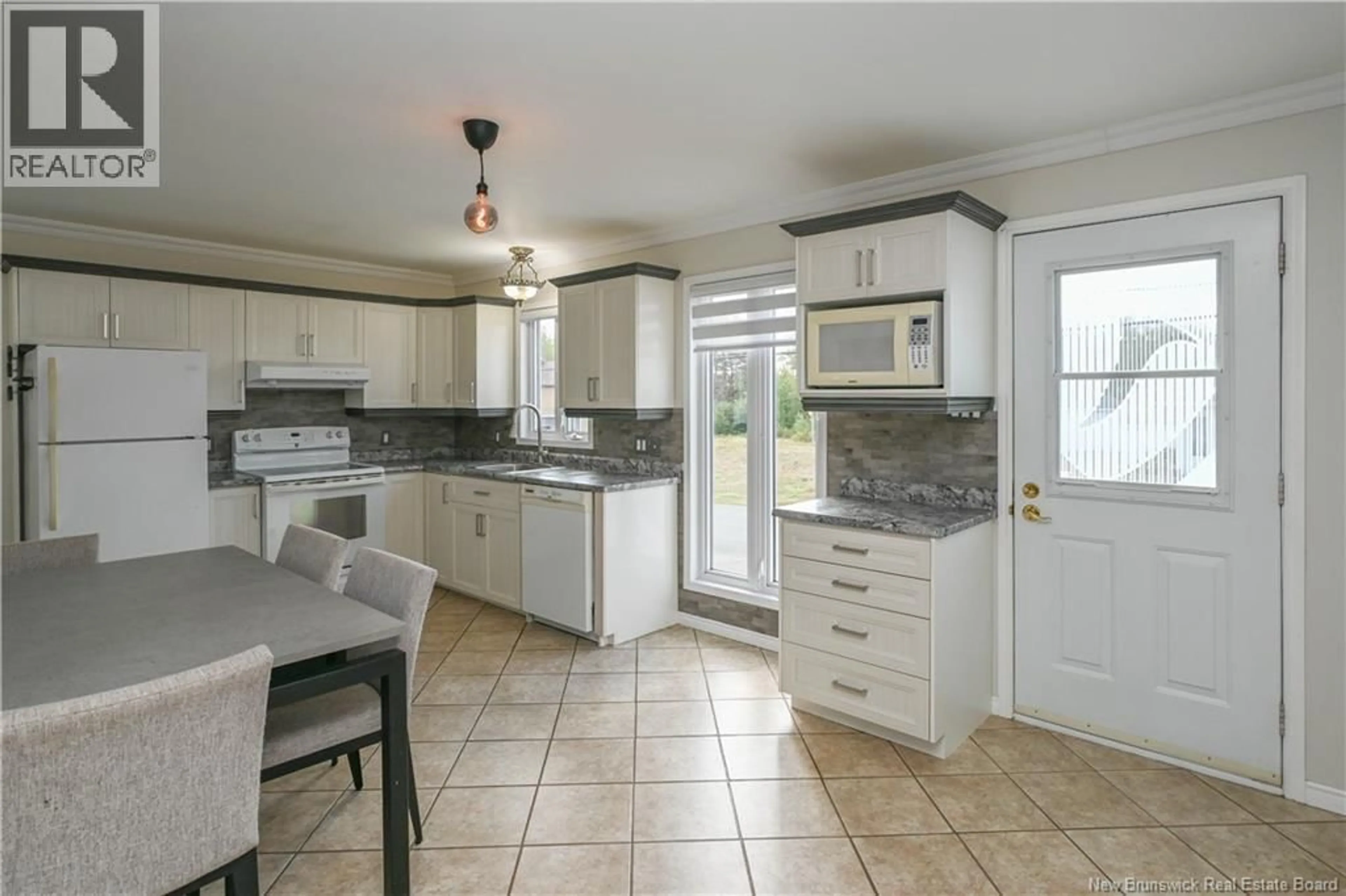 Open concept kitchen, ceramic/tile floor for 549 RUE SUZANNE STREET, Tracadie New Brunswick E1X1B5