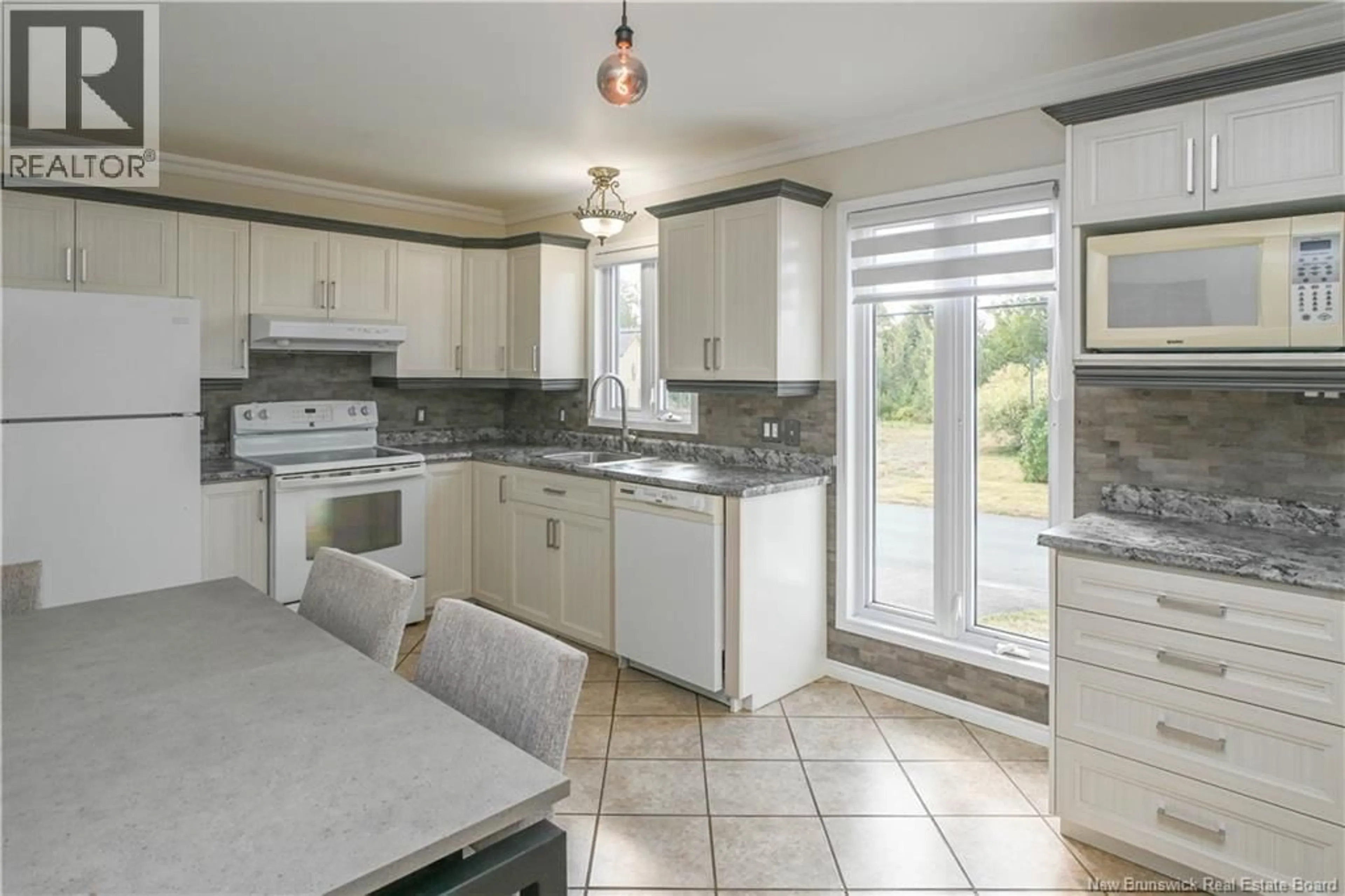Open concept kitchen, ceramic/tile floor for 549 RUE SUZANNE STREET, Tracadie New Brunswick E1X1B5