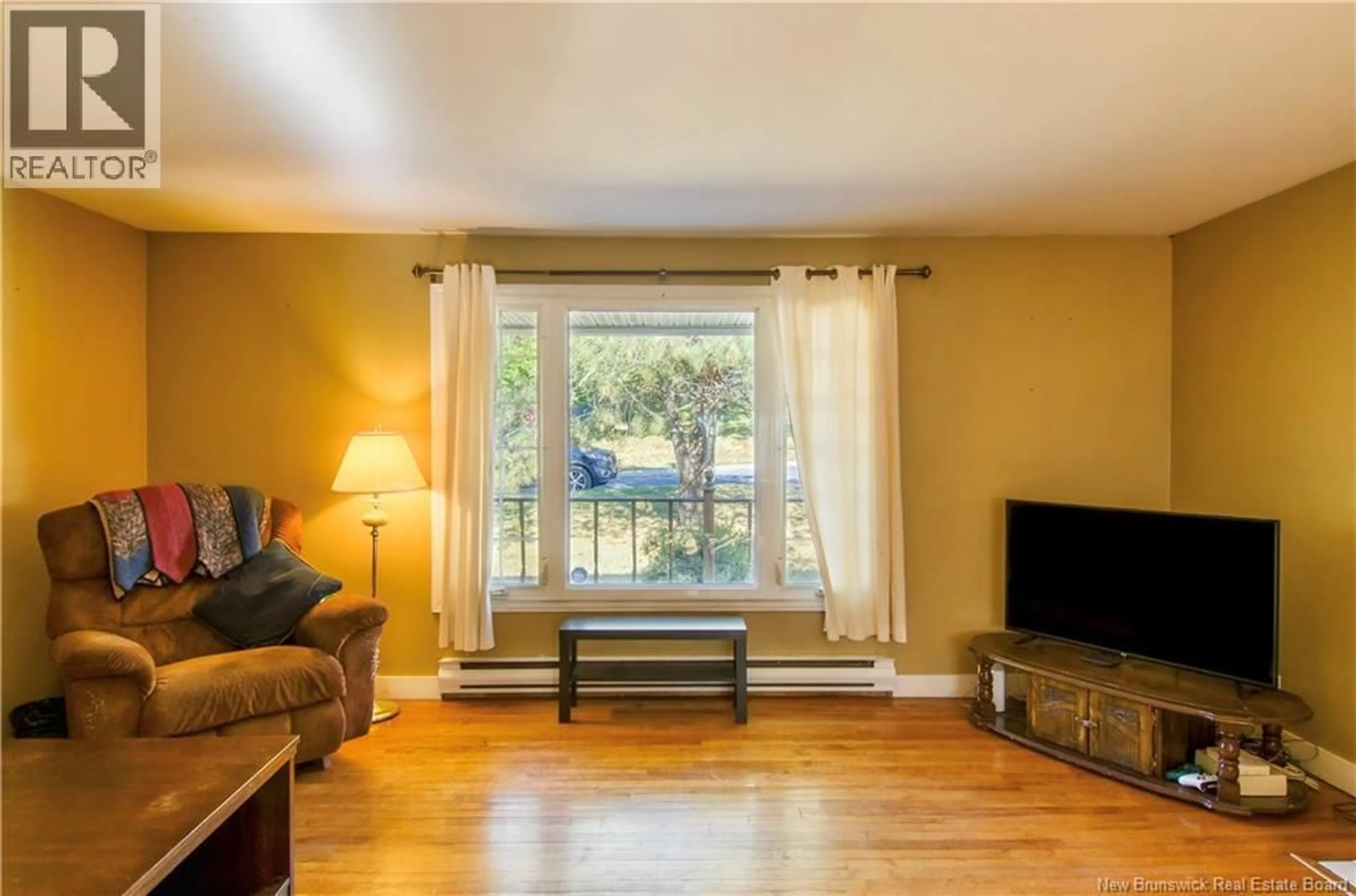 Living room with furniture, wood/laminate floor for 40 CREIGHTON AVENUE, Saint John New Brunswick E2J3G7