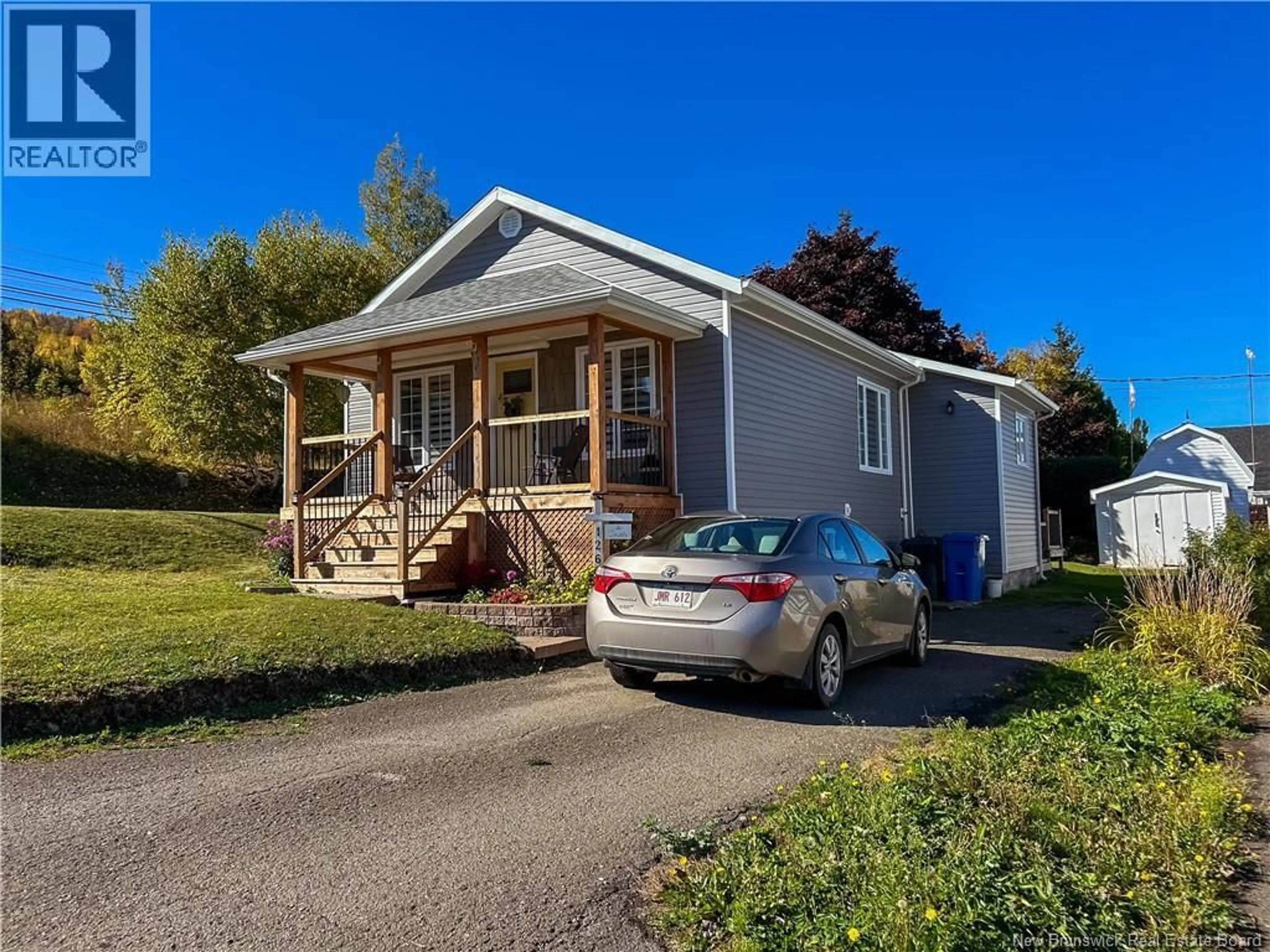Home with vinyl exterior material, street for 126 SYDNEY STREET, Dalhousie New Brunswick E8C2M7