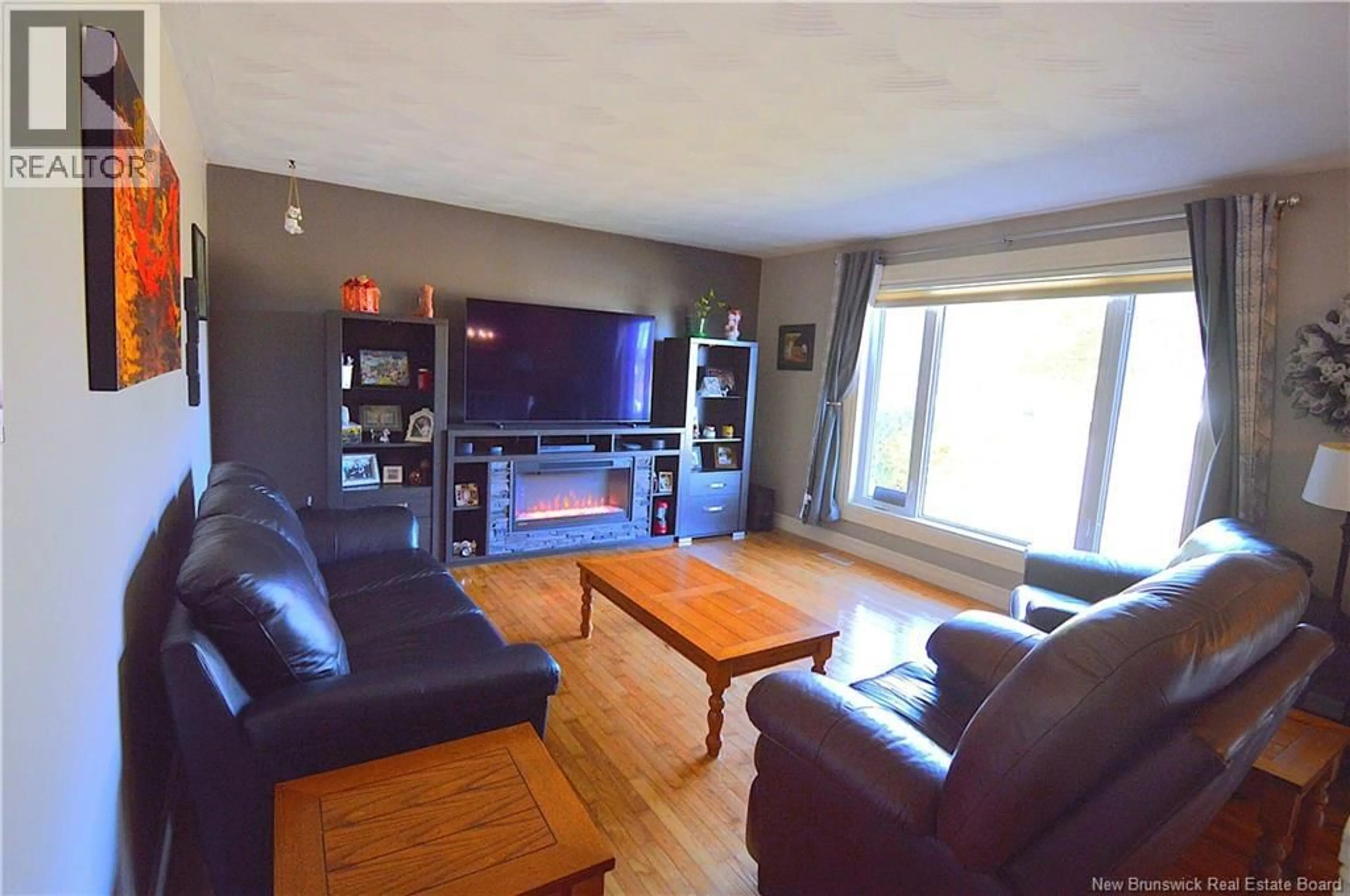 Living room with furniture, wood/laminate floor for 671 MAIN ST, Shediac New Brunswick E4P2C8