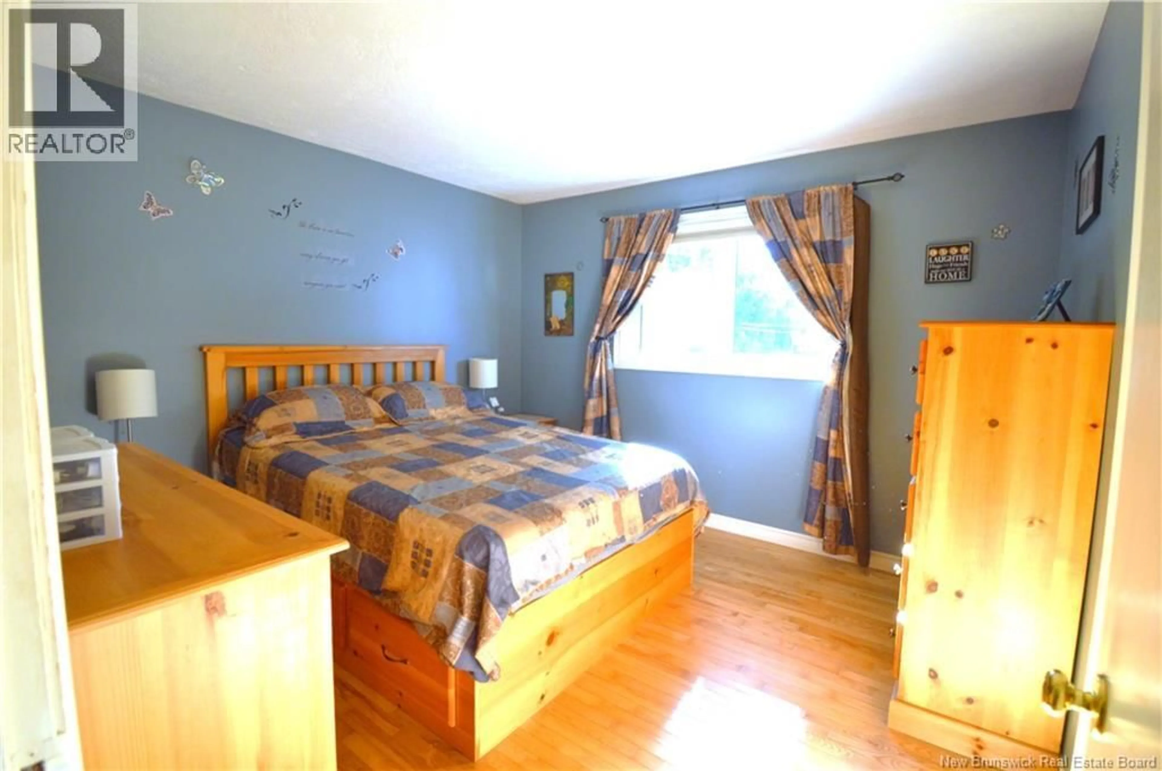 Bedroom with bed, wood/laminate floor for 671 MAIN ST, Shediac New Brunswick E4P2C8