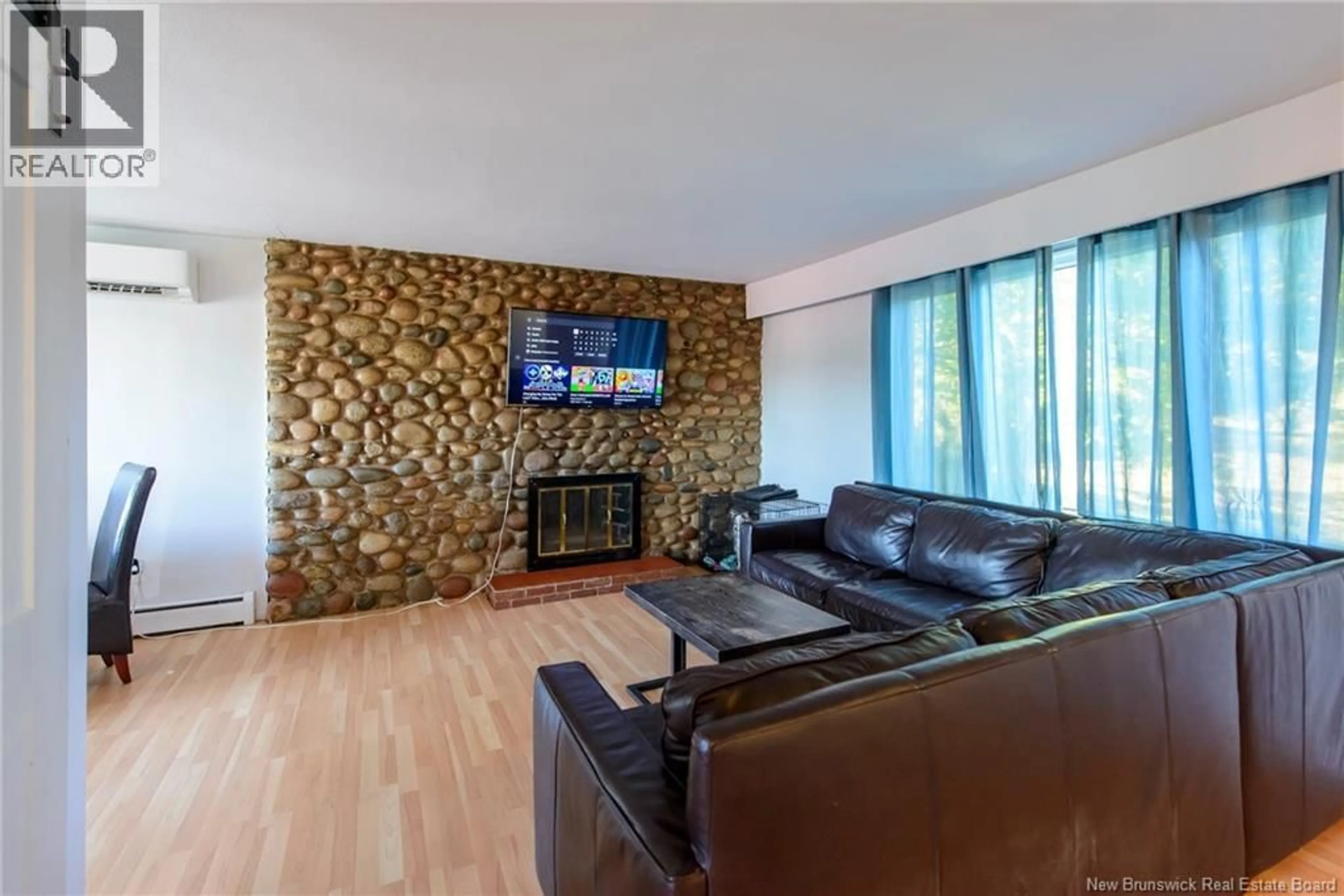 Living room with furniture, wood/laminate floor for 84 JOSSELYN ROAD, Saint John New Brunswick E2J3B5