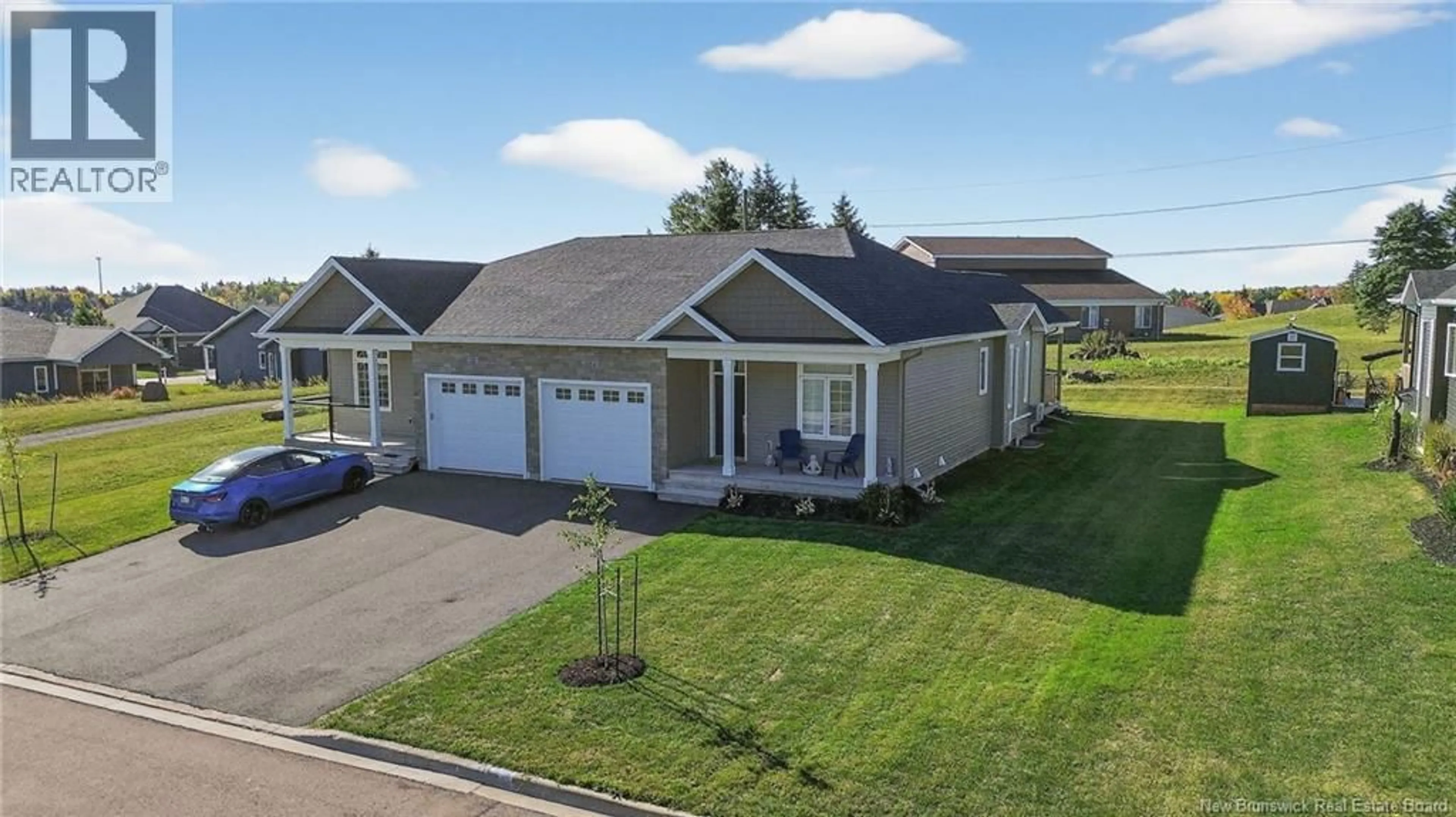 A pic from outside/outdoor area/front of a property/back of a property/a pic from drone, street for 24 EAGLEWOOD DRIVE, Moncton New Brunswick E1H0H3