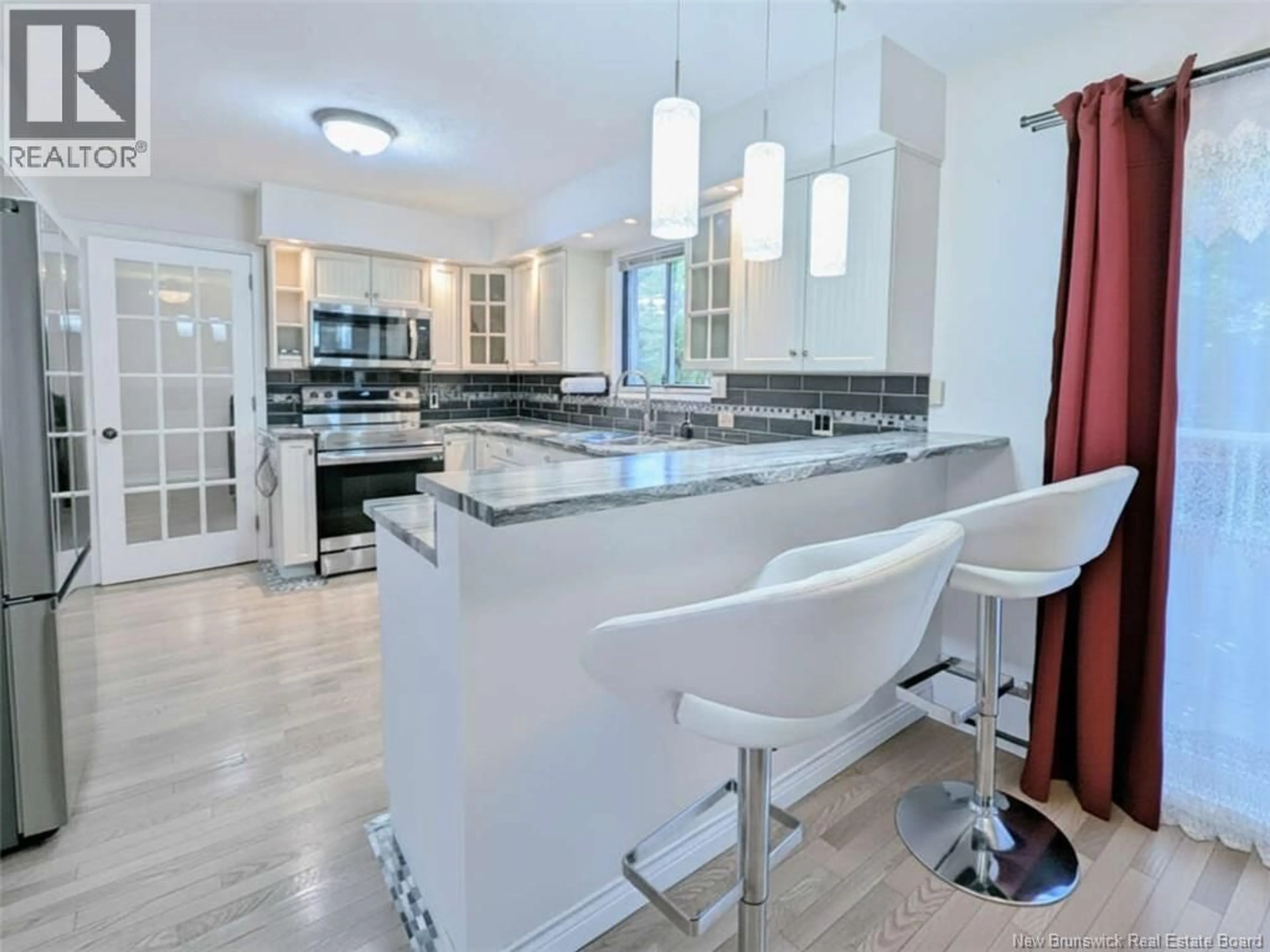 Open concept kitchen, ceramic/tile floor for 1A HEATHER TERRACE, Fredericton New Brunswick E3B2S7