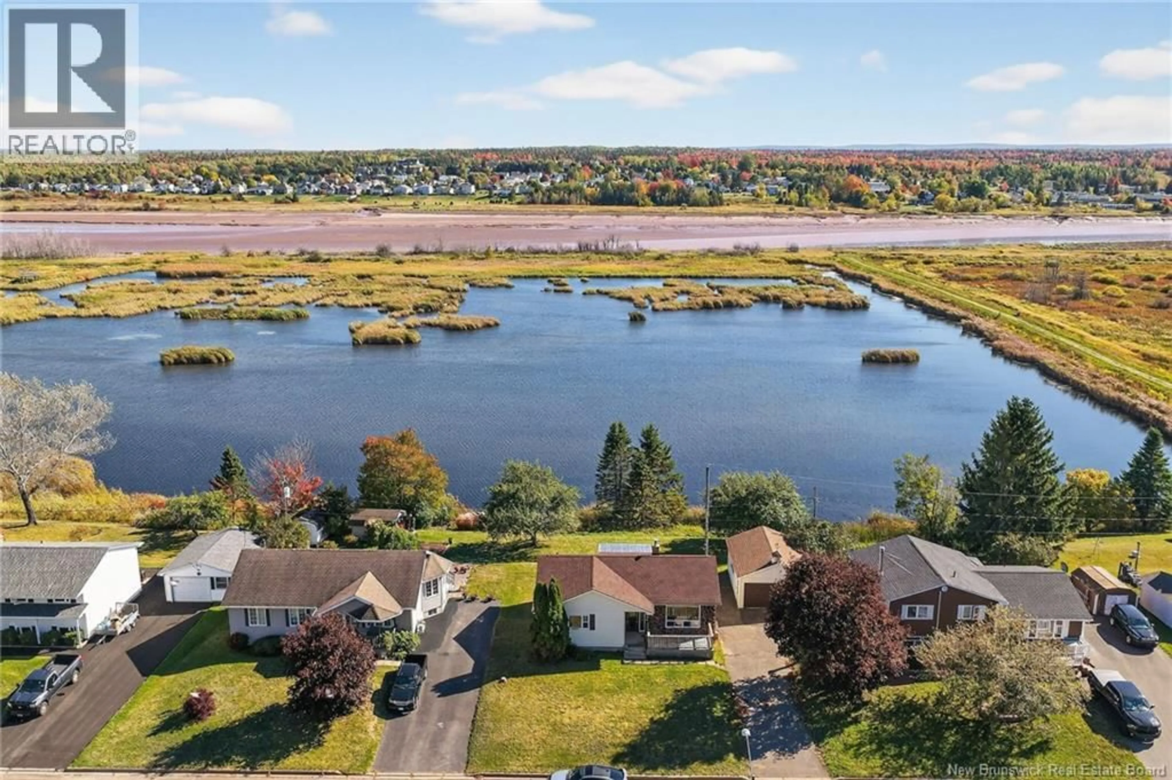 A pic from outside/outdoor area/front of a property/back of a property/a pic from drone, water/lake/river/ocean view for 20 MARINA DRIVE, Moncton New Brunswick E1E4B6