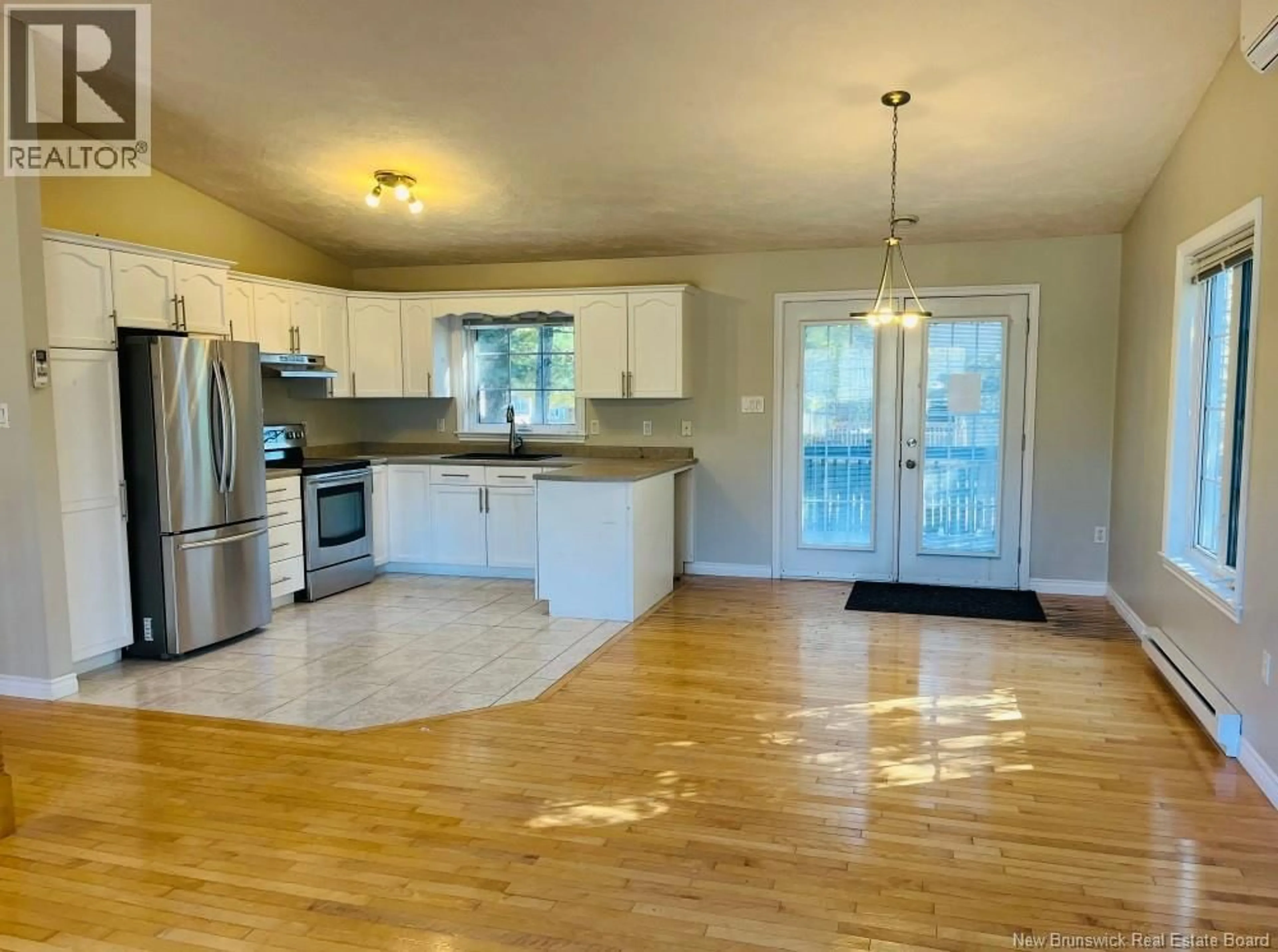 Open concept kitchen, wood/laminate floor for 28 FRANCELLE CRESCENT, Dieppe New Brunswick E1A7V3