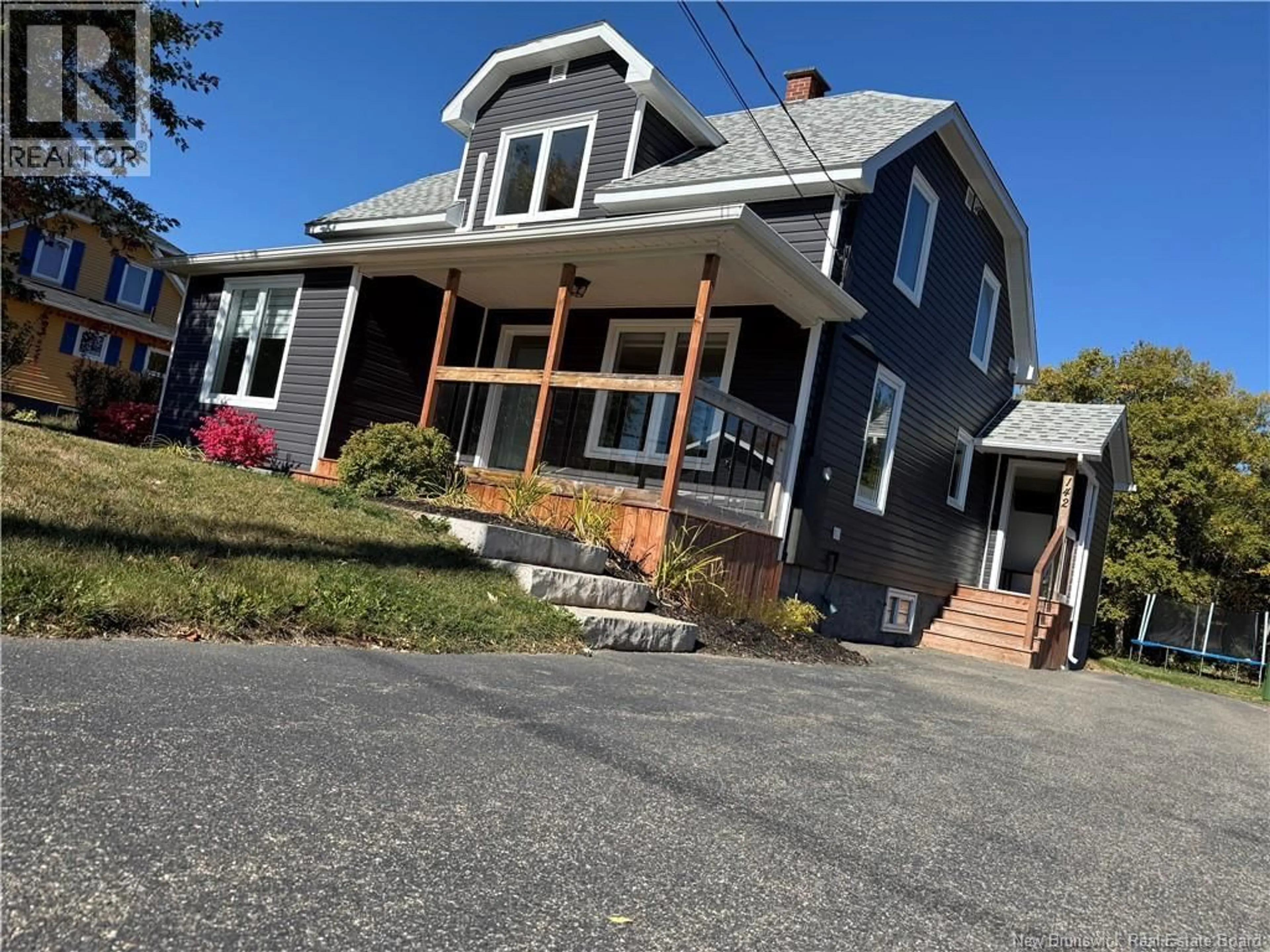 Home with vinyl exterior material, street for 142 RUE LAPLANTE O, Petit-Rocher New Brunswick E8J1T1