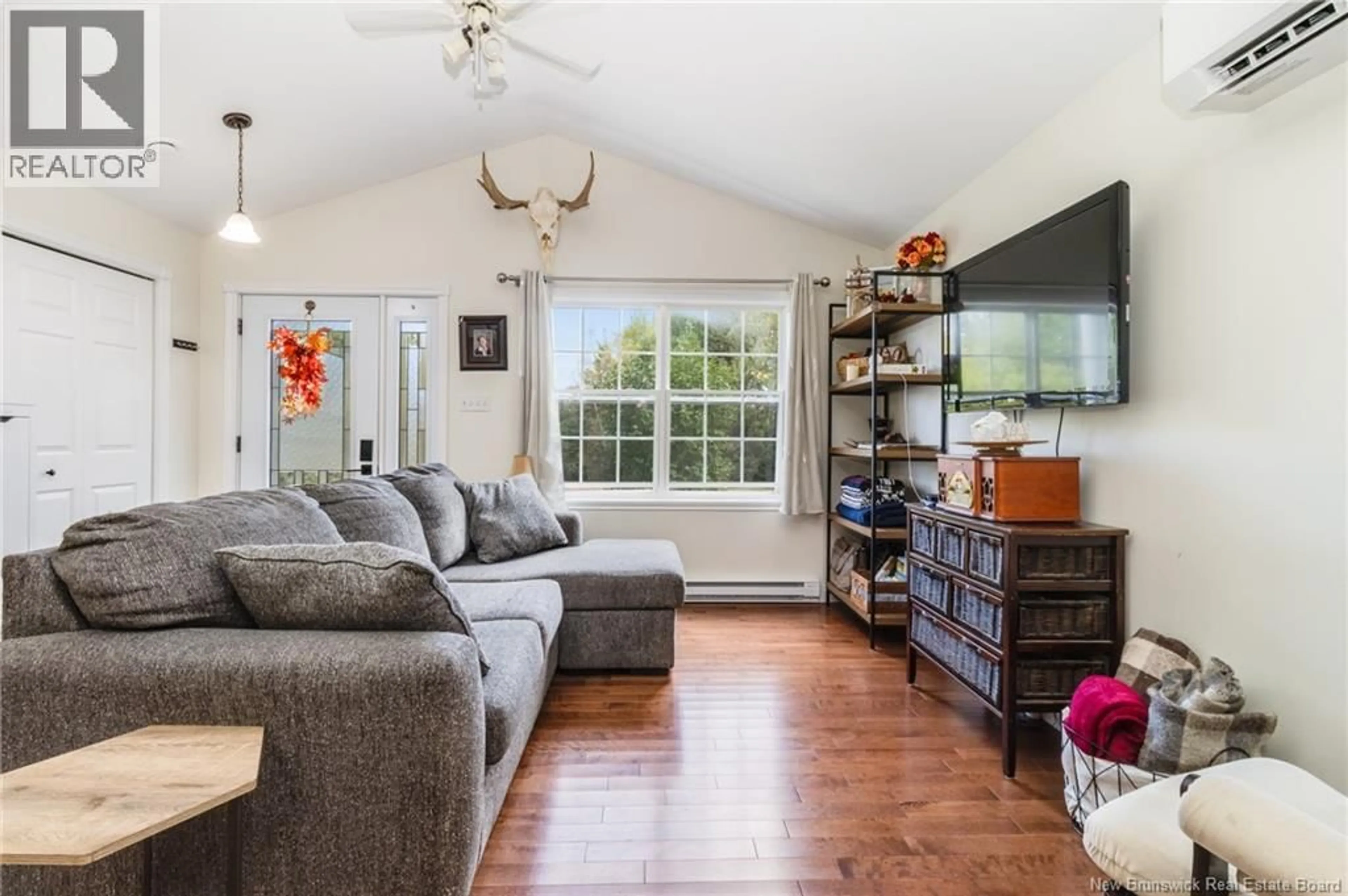 Living room with furniture, wood/laminate floor for 23 ROUTE 617, Burtts Corner New Brunswick E6L2X4