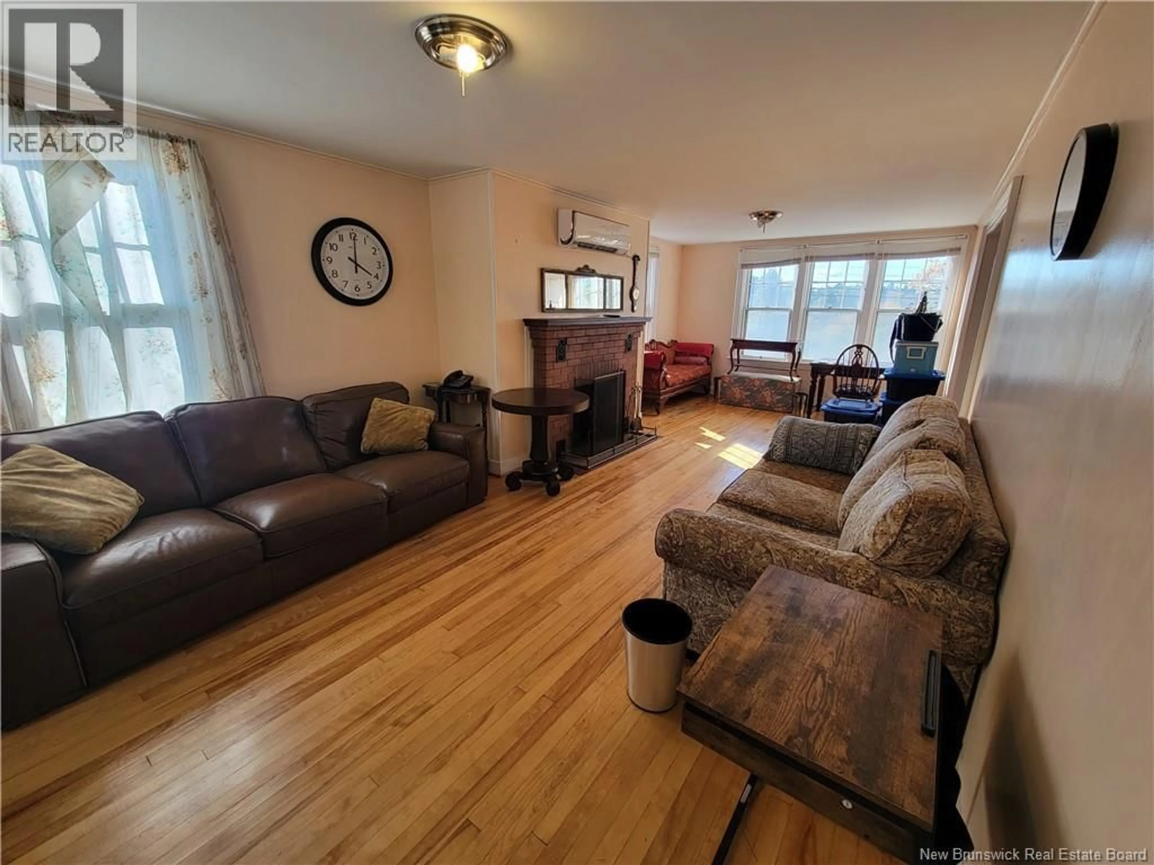 Living room with furniture, wood/laminate floor for 1982 ROTHESAY ROAD, Rothesay New Brunswick E2H2J8