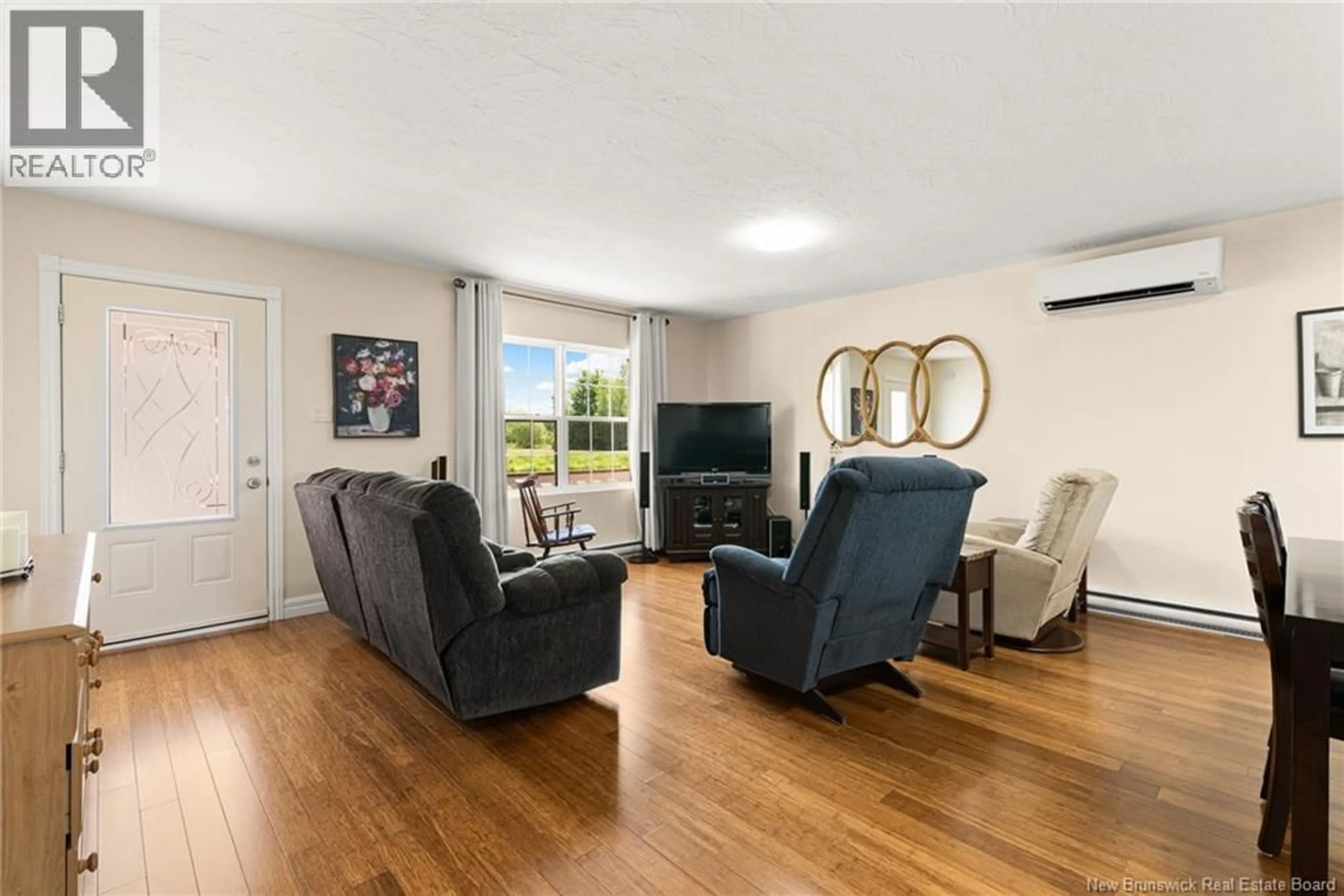 Living room with furniture, wood/laminate floor for 35 LA VUE DES BOURQUE, Grande-Digue New Brunswick E4R0C1