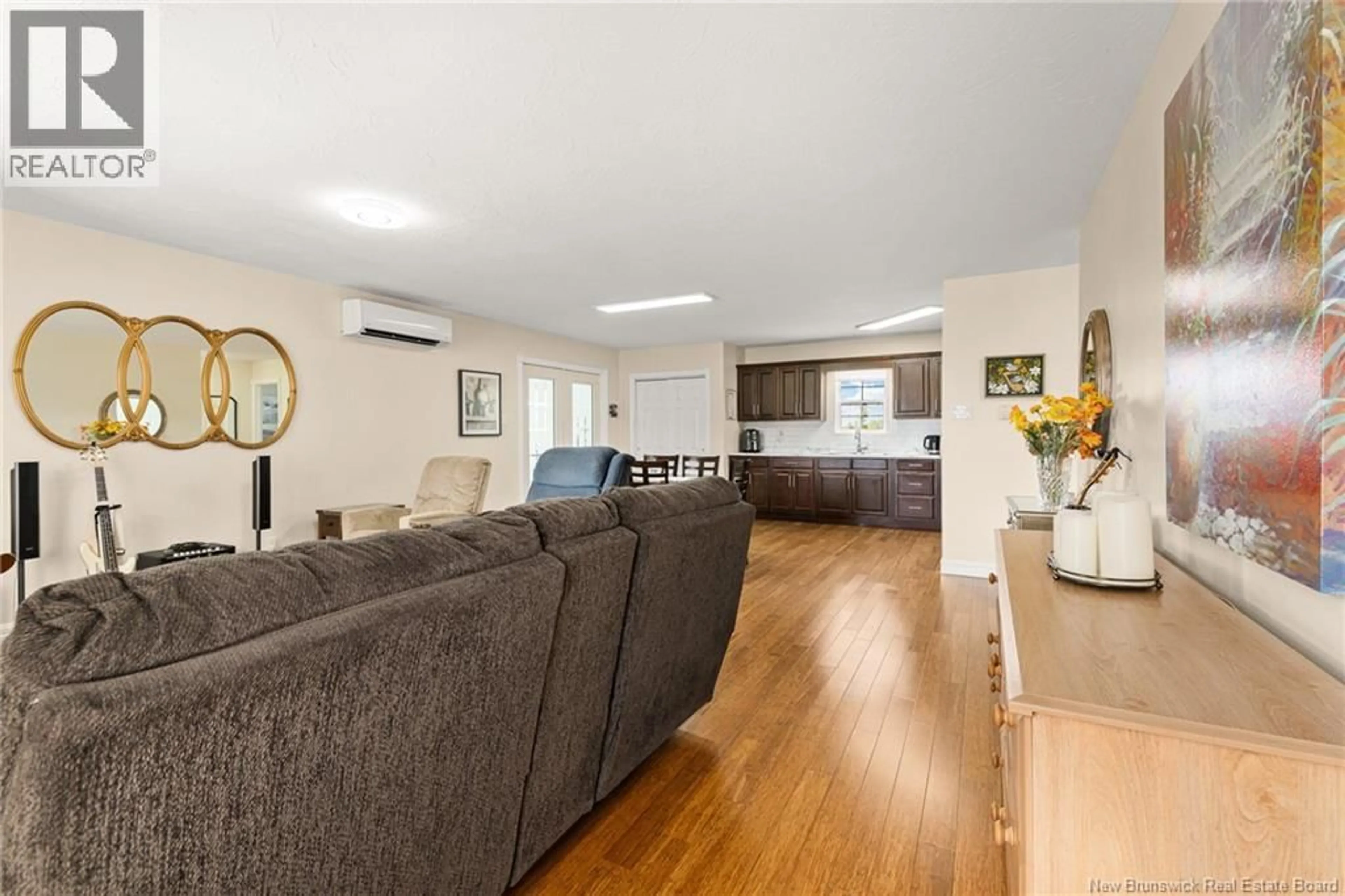 Living room with furniture, wood/laminate floor for 35 LA VUE DES BOURQUE, Grande-Digue New Brunswick E4R0C1