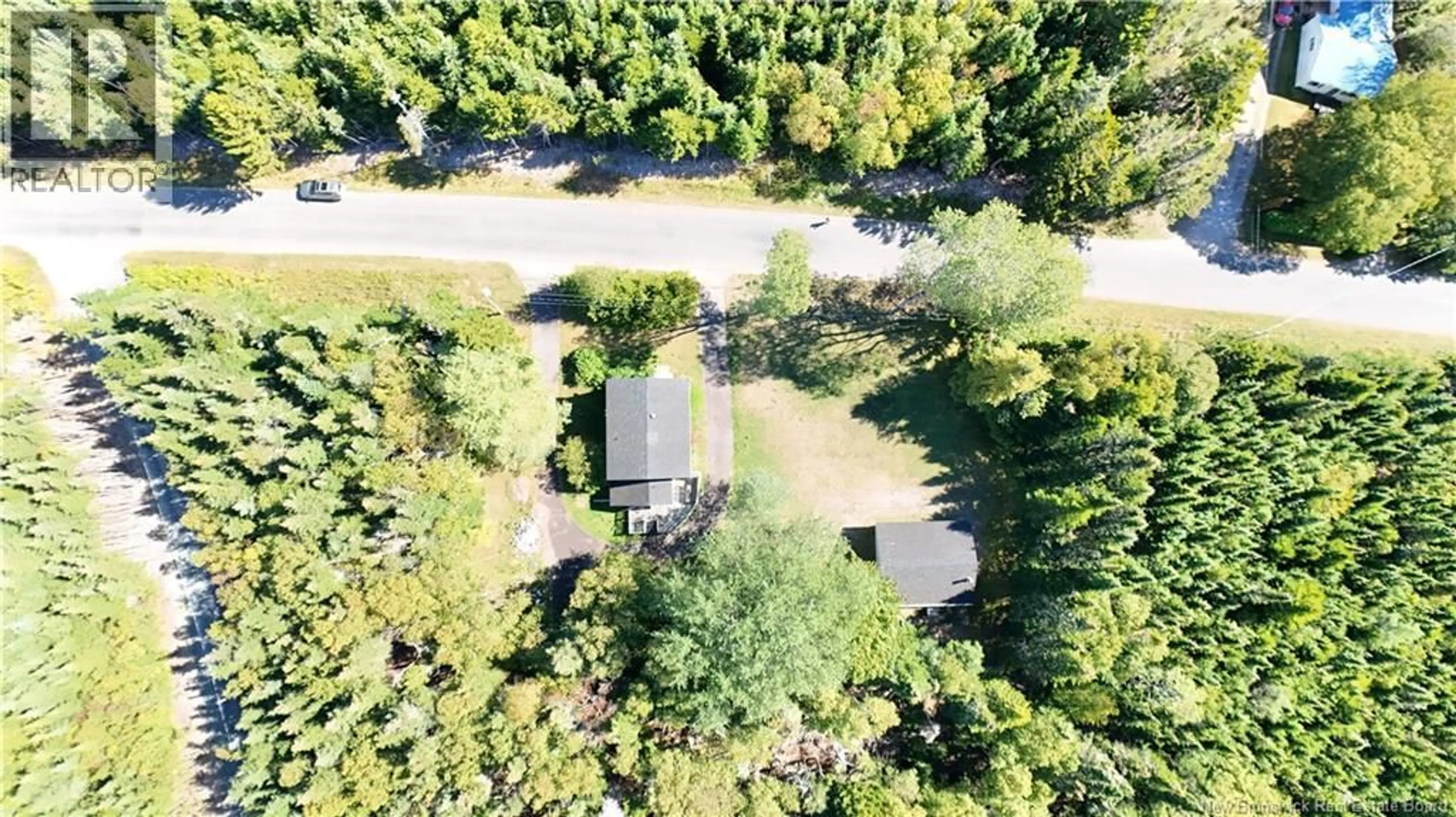 A pic from outside/outdoor area/front of a property/back of a property/a pic from drone, forest/trees view for 24 HAGGERTY'S COVE ROAD, New River Beach New Brunswick E5J1J6