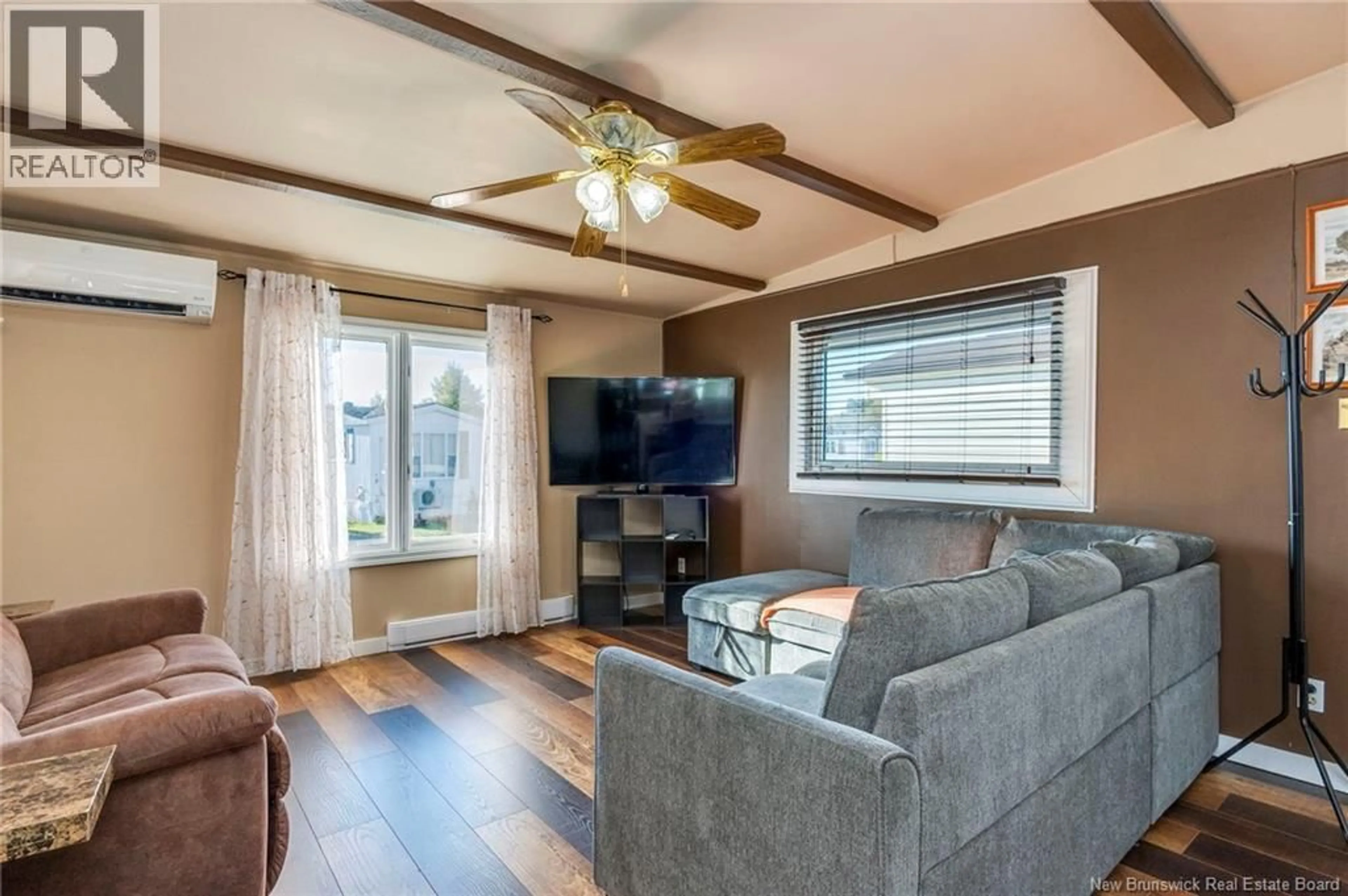 Living room with furniture, wood/laminate floor for 9 SANDPIPER ROAD, Saint John New Brunswick E2J3W7