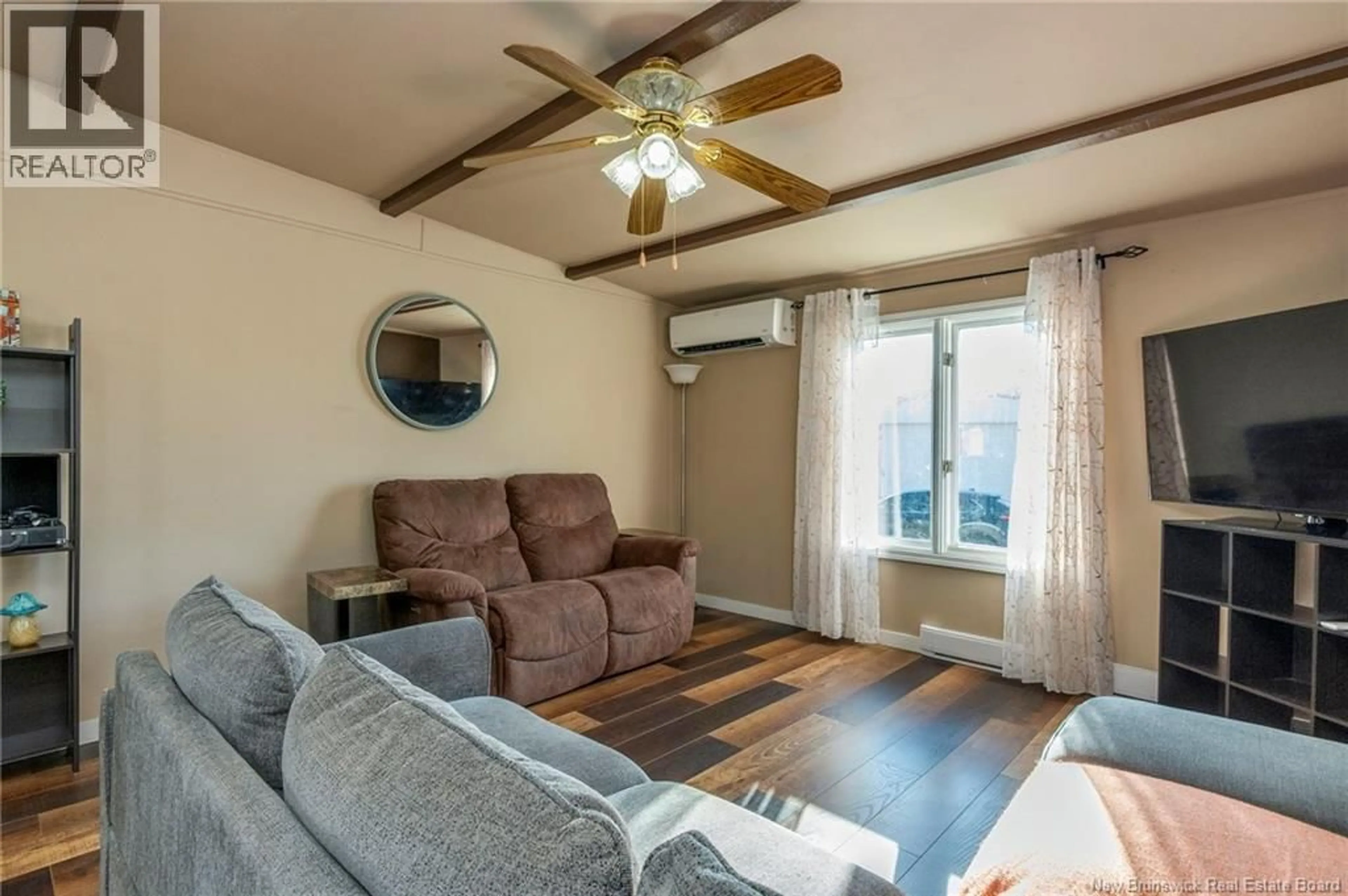 Living room with furniture, wood/laminate floor for 9 SANDPIPER ROAD, Saint John New Brunswick E2J3W7