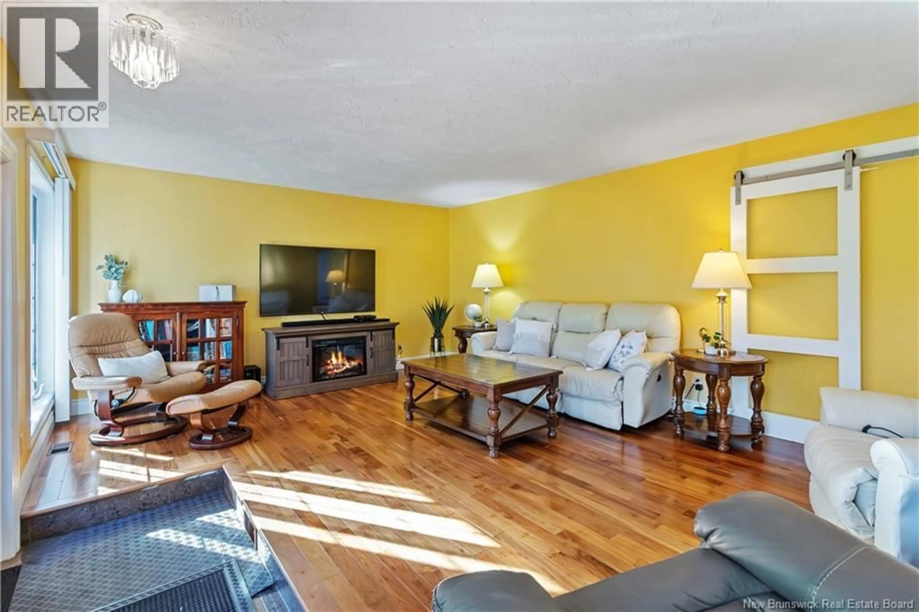 Living room with furniture, wood/laminate floor for 965 FRAMPTON LANE, Moncton New Brunswick E1G1M2