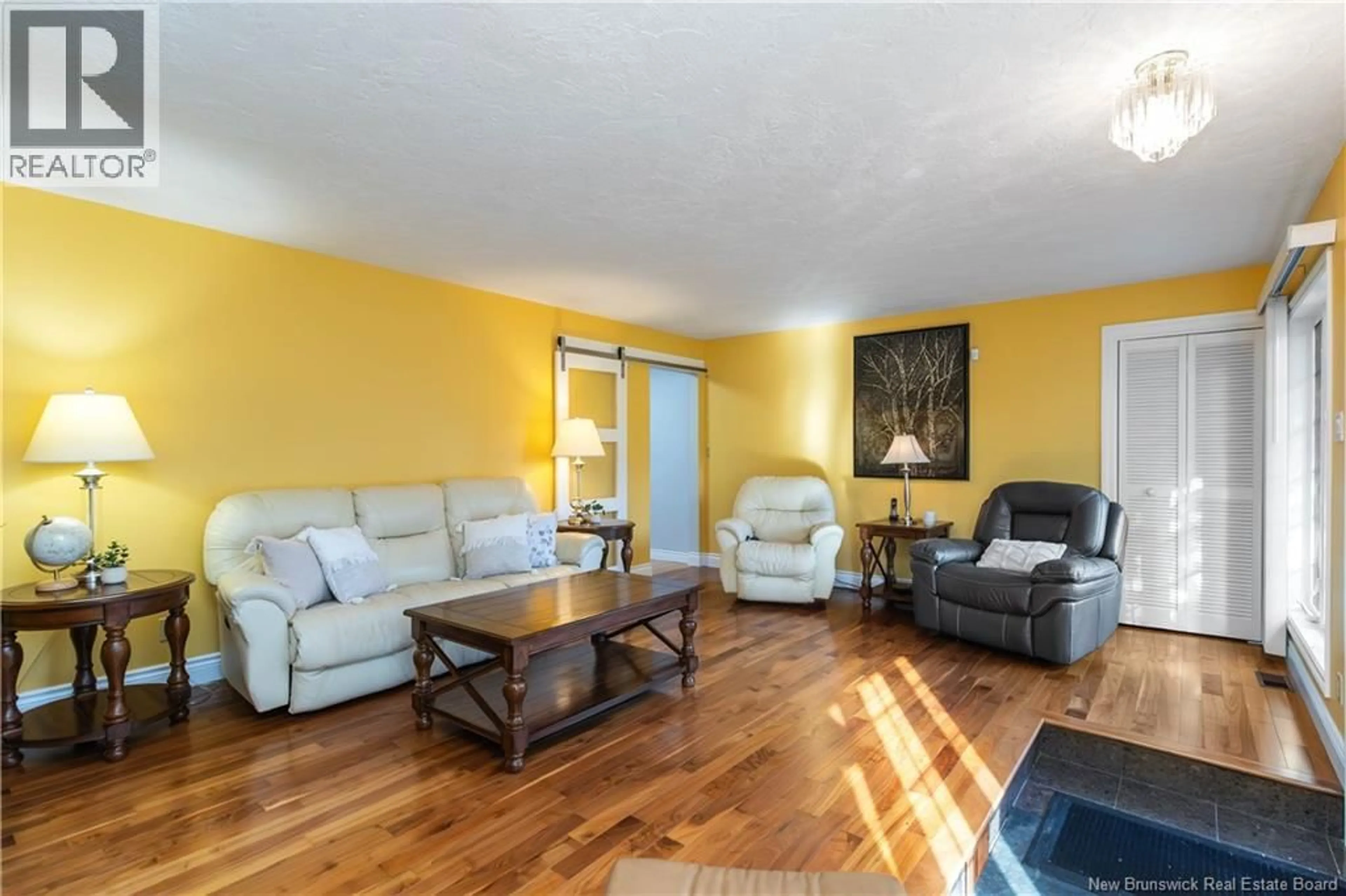 Living room with furniture, wood/laminate floor for 965 FRAMPTON LANE, Moncton New Brunswick E1G1M2