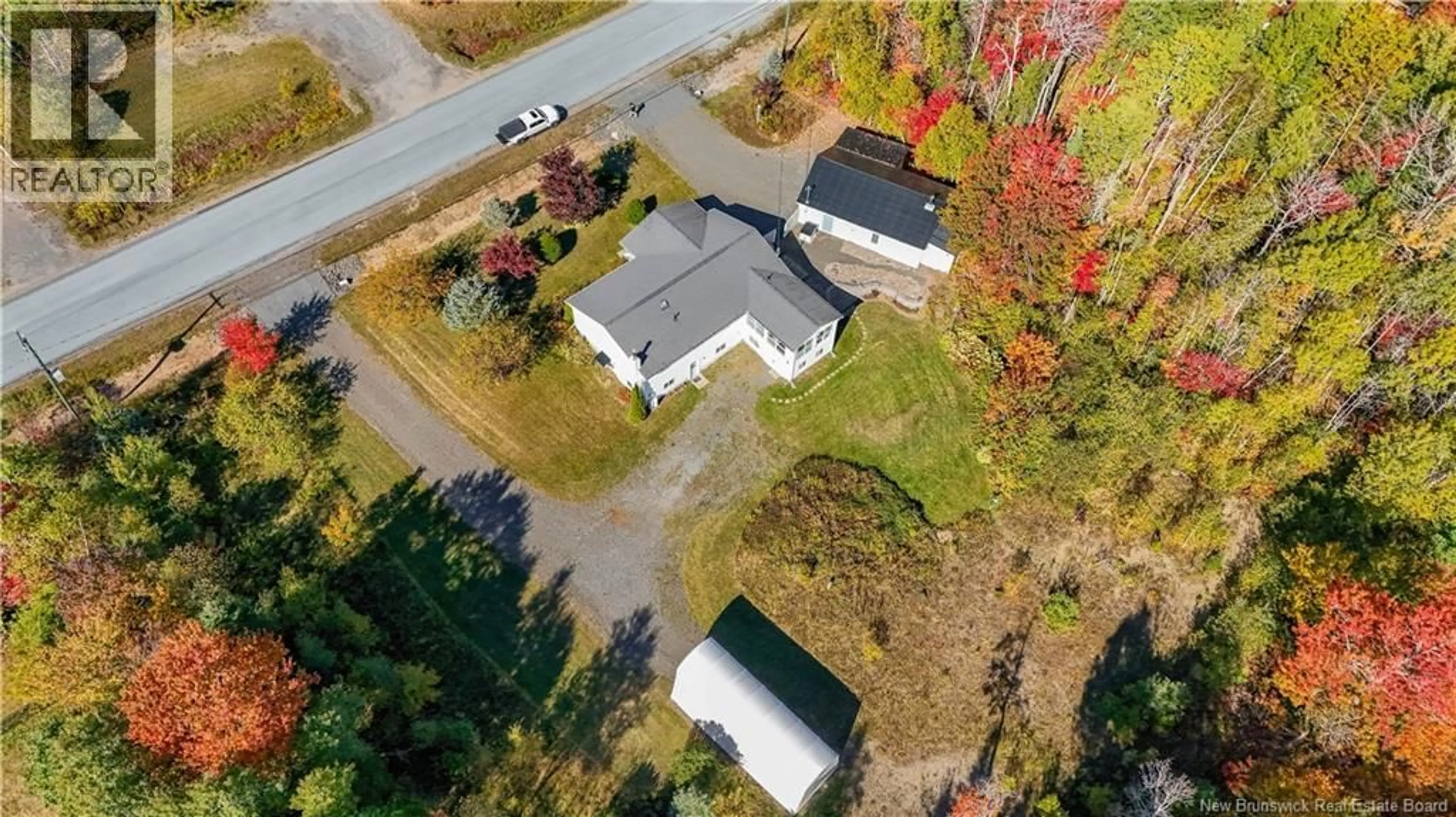 A pic from outside/outdoor area/front of a property/back of a property/a pic from drone, street for 152 MARLOW ROAD, Hanwell New Brunswick E3C1M6