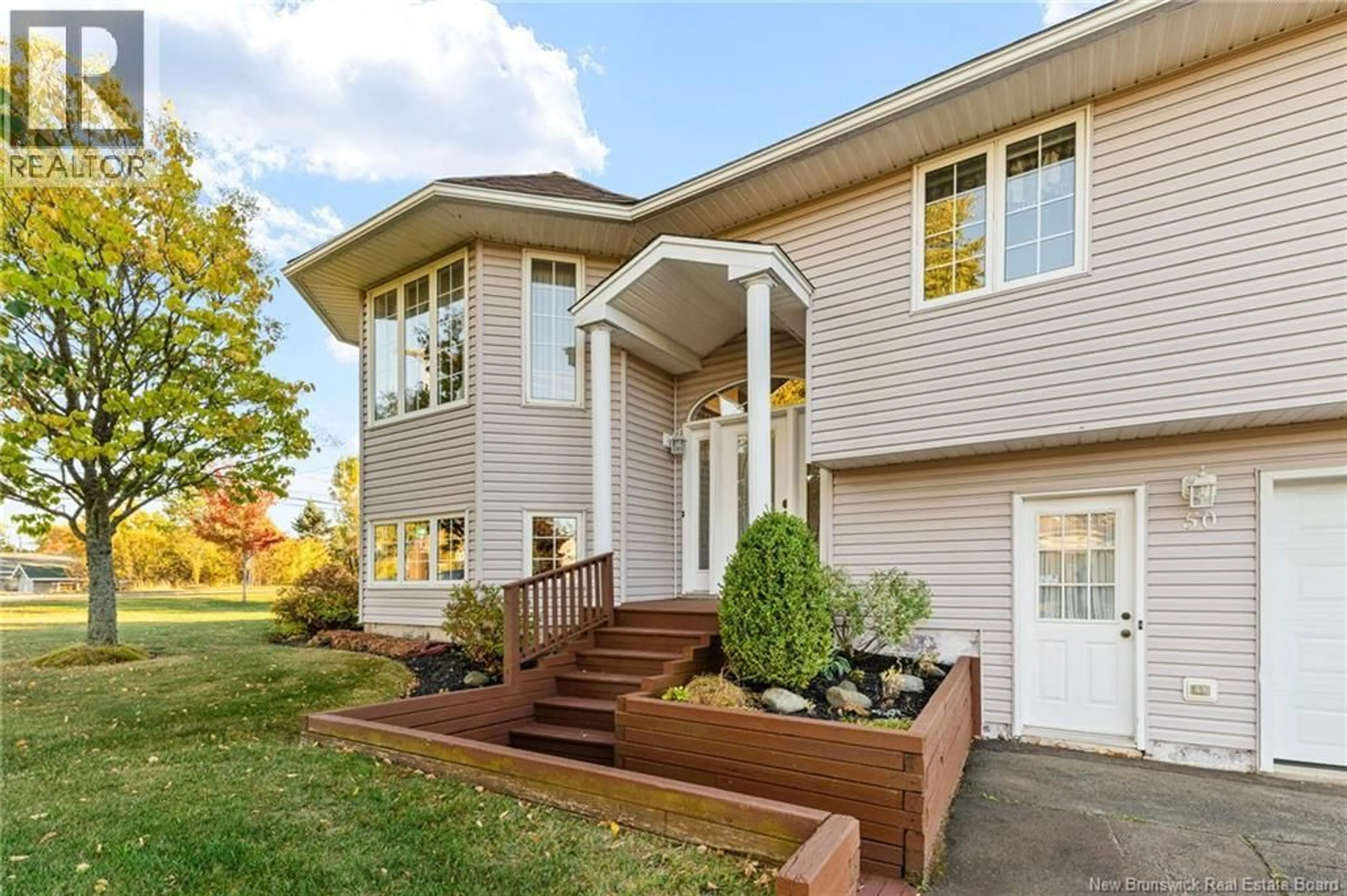 Home with vinyl exterior material, street for 50 IVY ROAD, Moncton New Brunswick E1G2H4