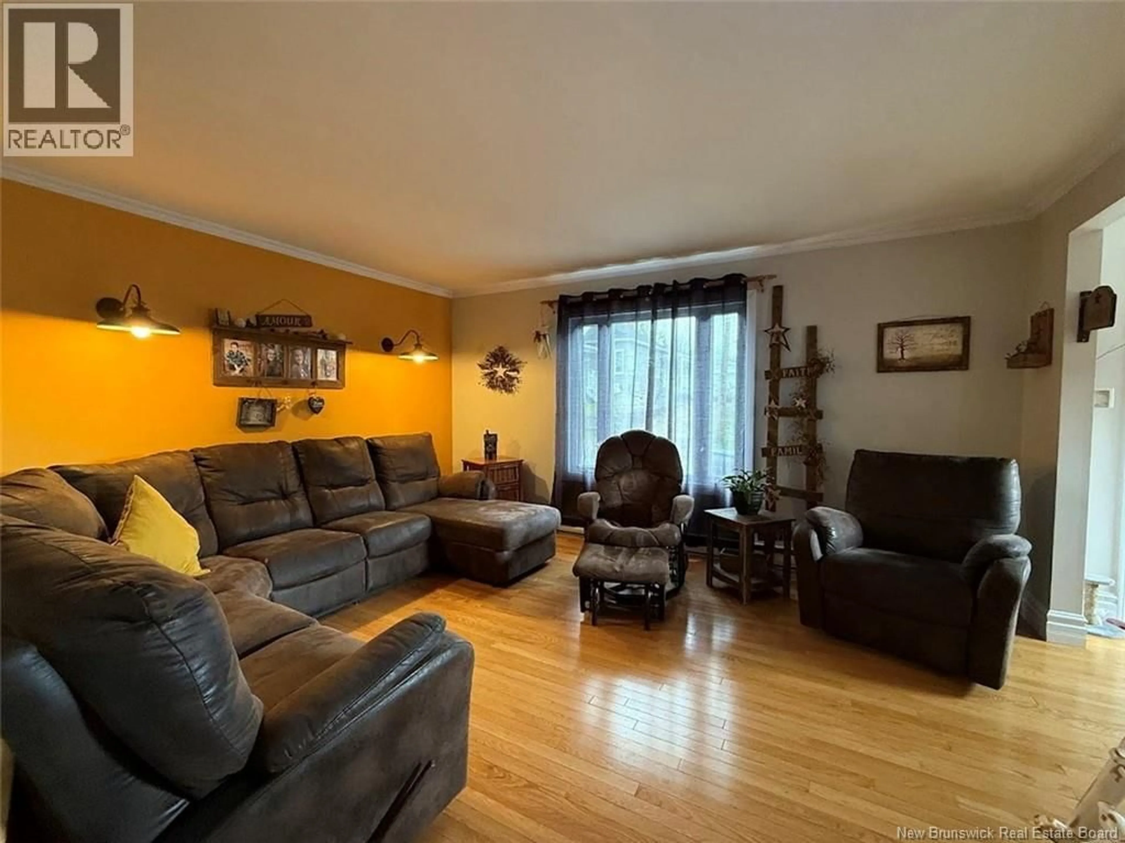 Living room with furniture, wood/laminate floor for 84 39TH AVENUE, Edmundston New Brunswick E3V2X2