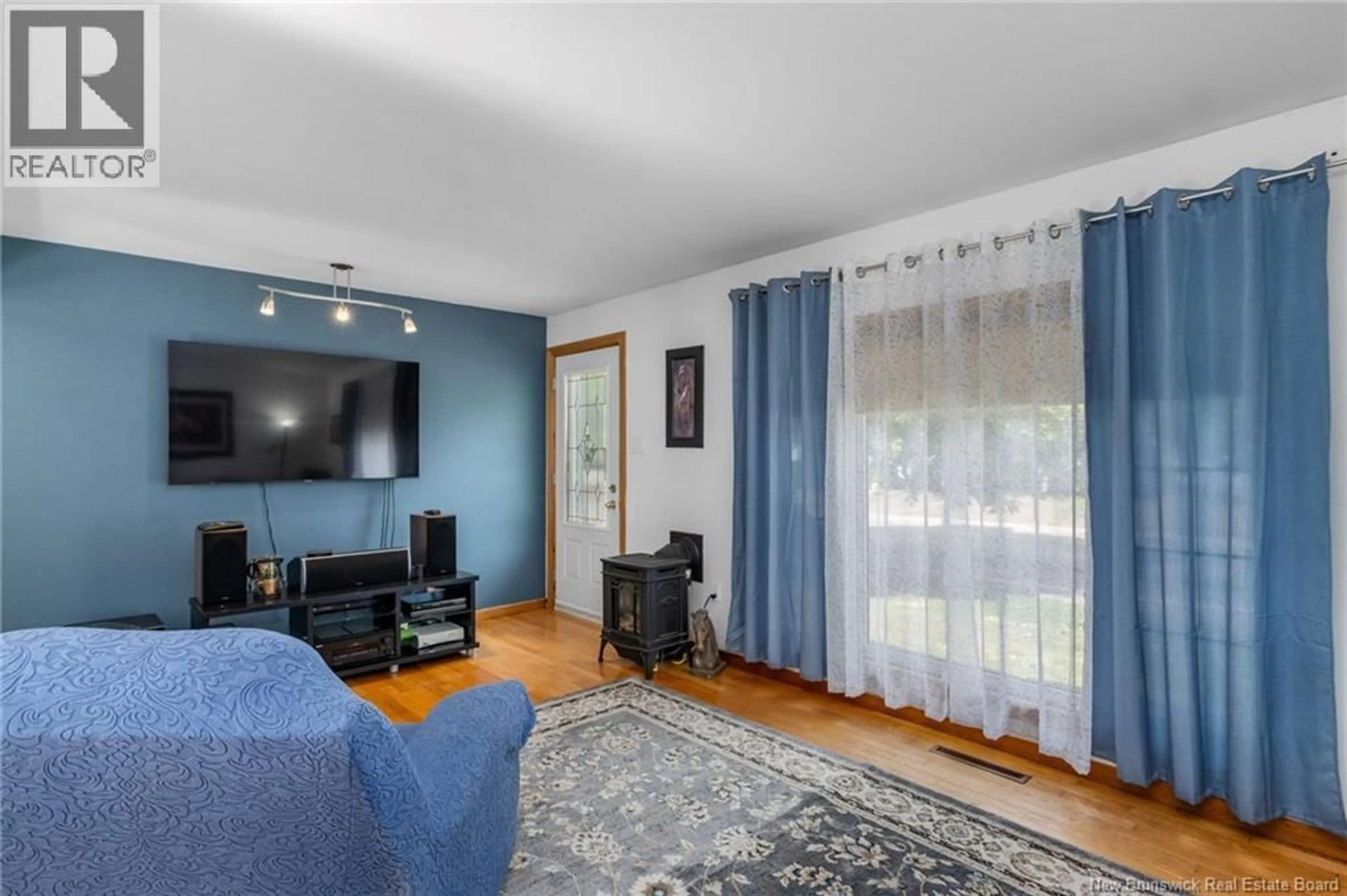Living room with furniture, wood/laminate floor for 269 WHITEPINE ROAD, Riverview New Brunswick E1B2X2