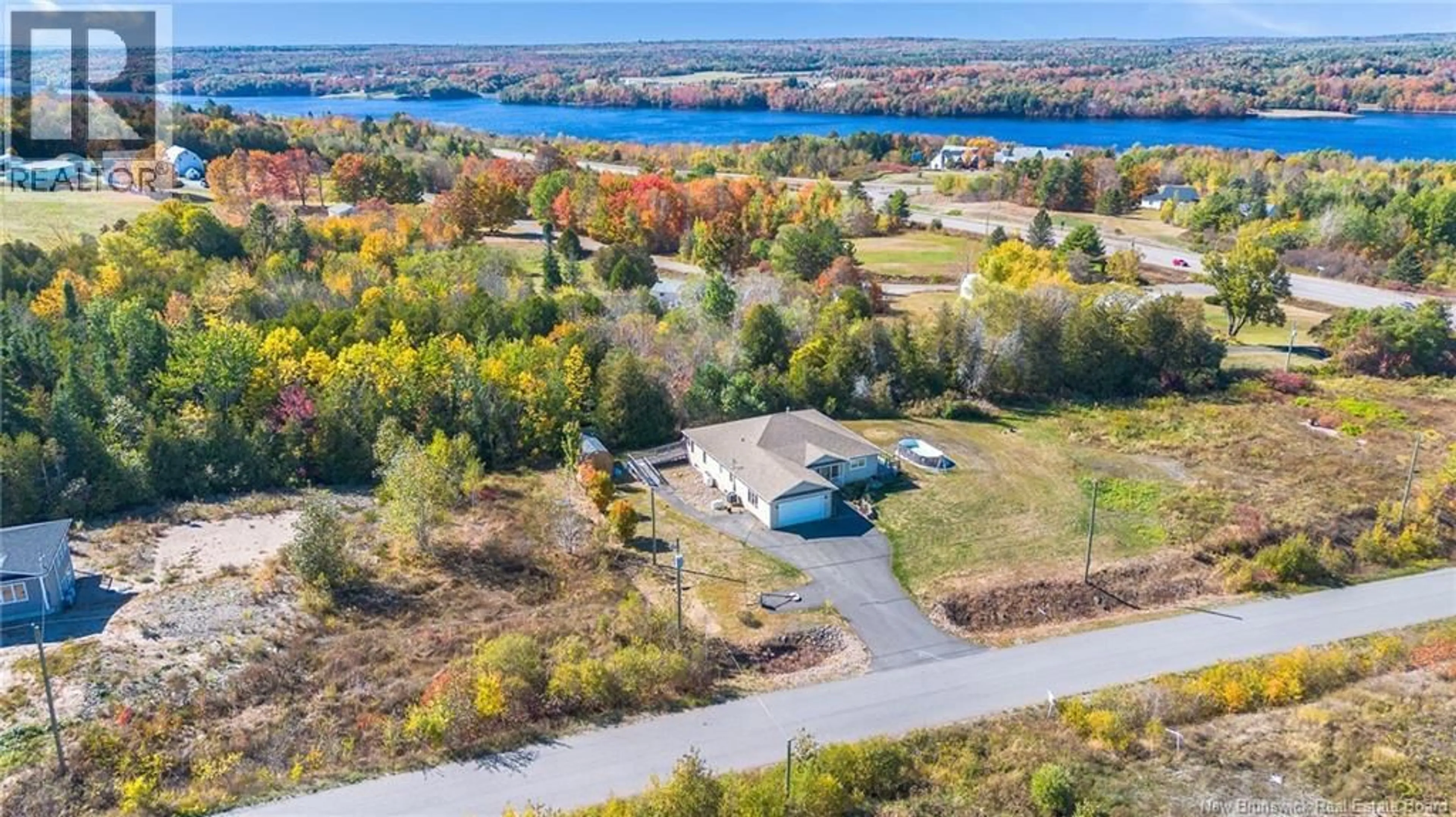 A pic from outside/outdoor area/front of a property/back of a property/a pic from drone, water/lake/river/ocean view for 10 WHITETAIL STREET, Lower Kingsclear New Brunswick E3E0E7