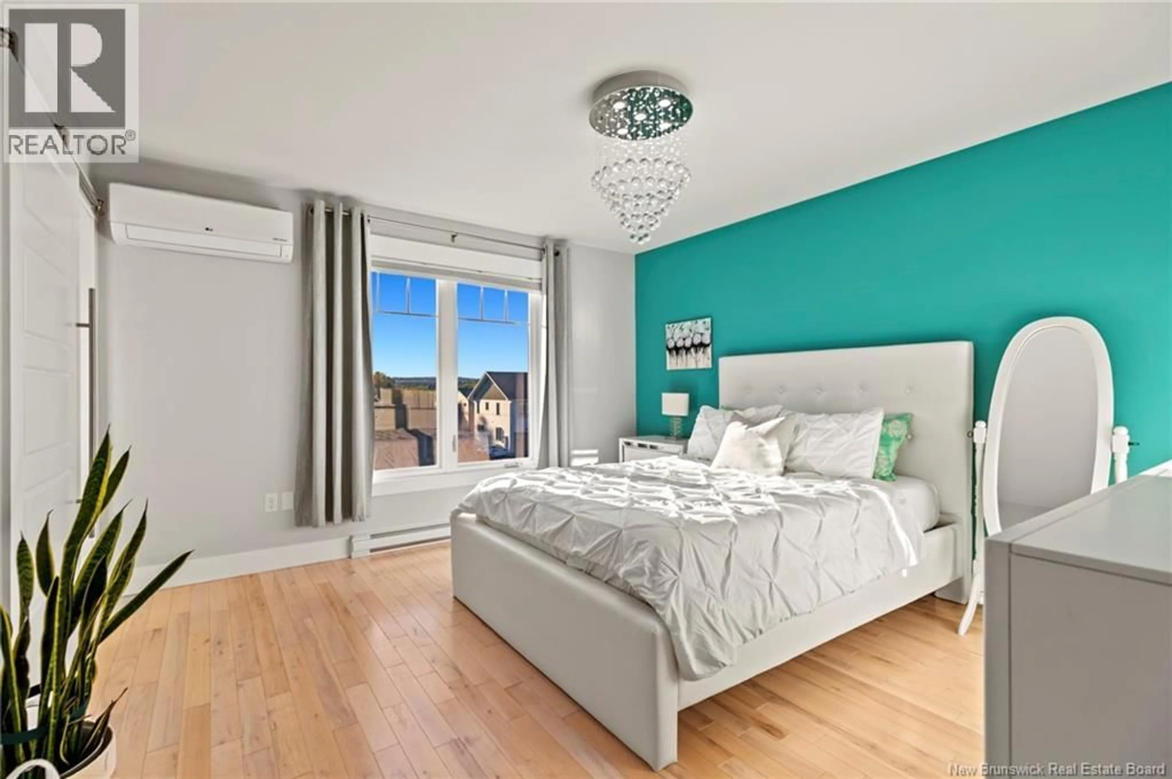 Bedroom with bed, wood/laminate floor for 116 MIA CIRCLE, Fredericton New Brunswick E3A7N5