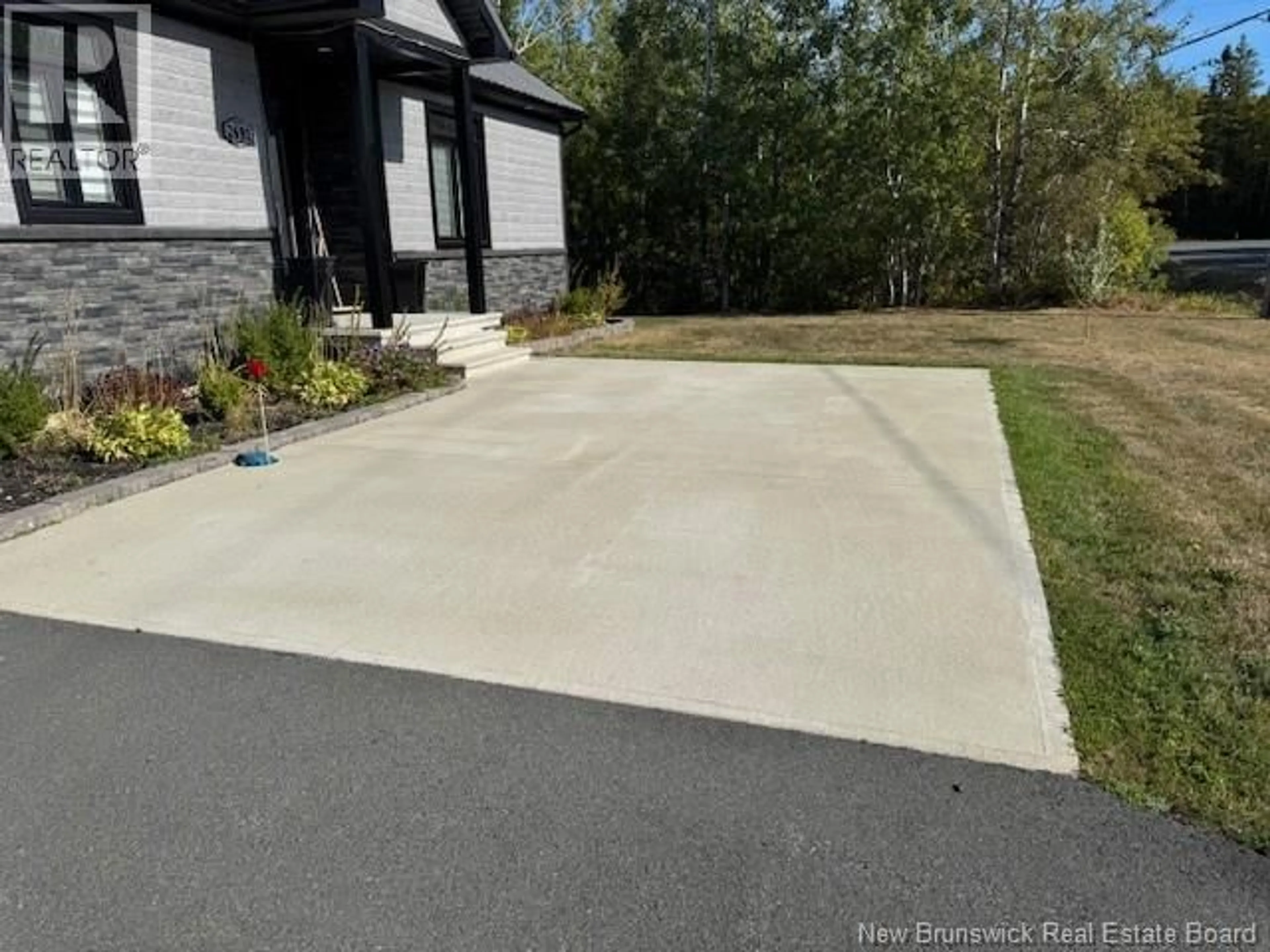 A pic from outside/outdoor area/front of a property/back of a property/a pic from drone, street for 2691 CH R. CARRIE, Tracadie New Brunswick E1X0C7