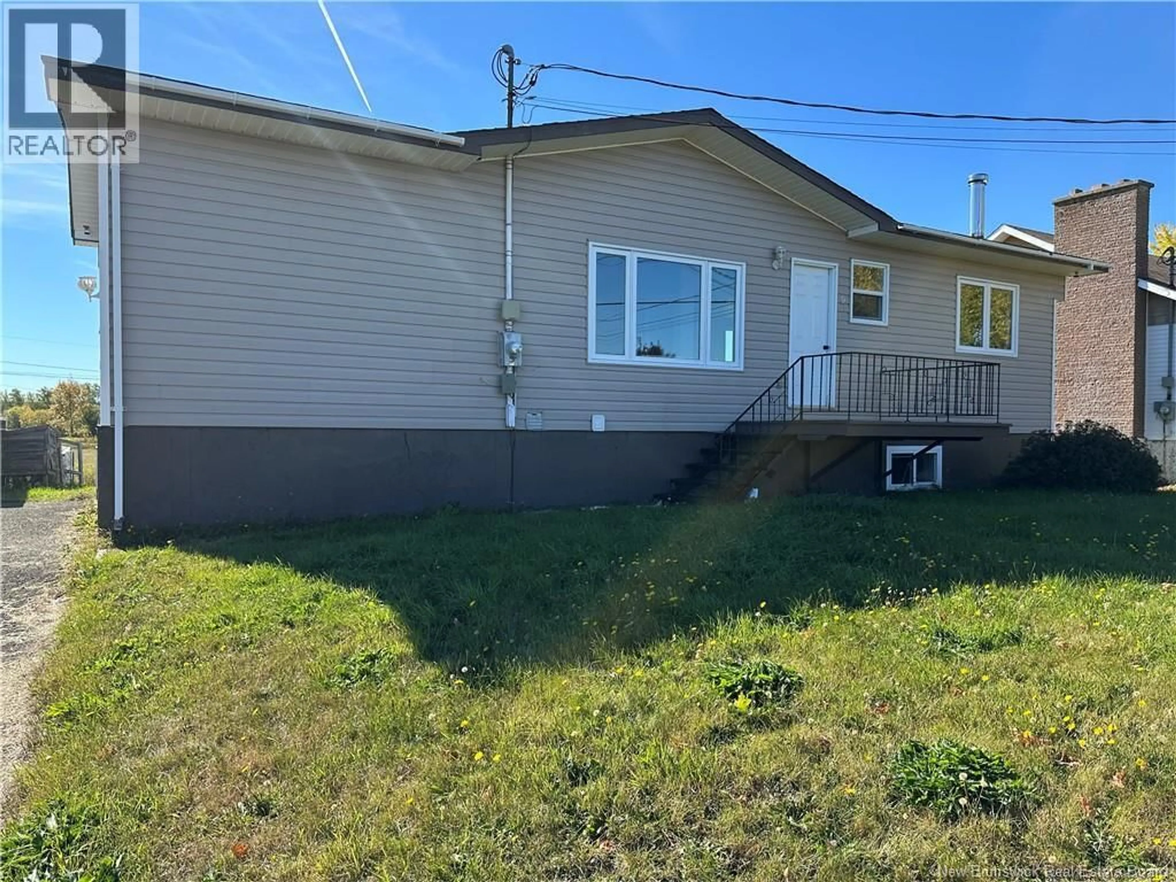 Home with vinyl exterior material, street for 9 FRANÇOIS STREET, Charlo New Brunswick E8E2J8
