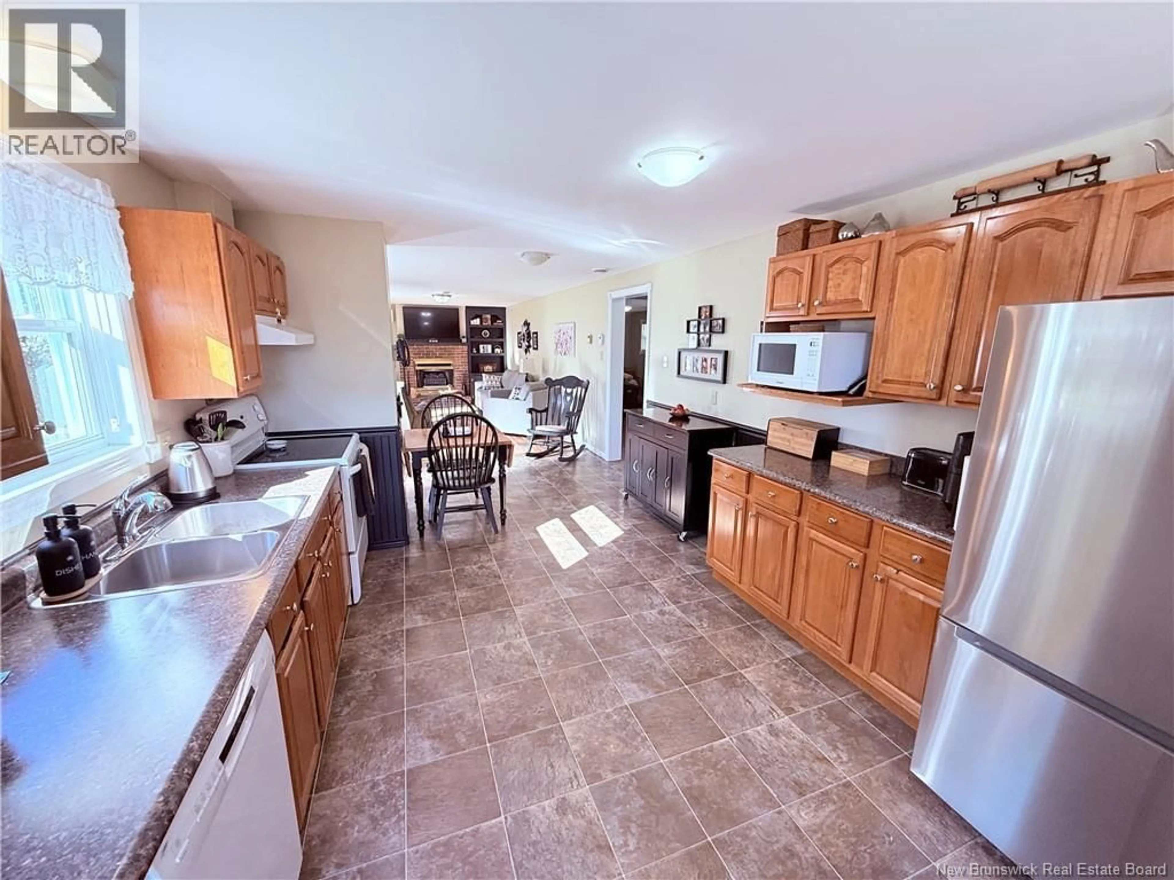 Open concept kitchen, ceramic/tile floor for 108 FISHER AVENUE, Woodstock New Brunswick E7M1S2