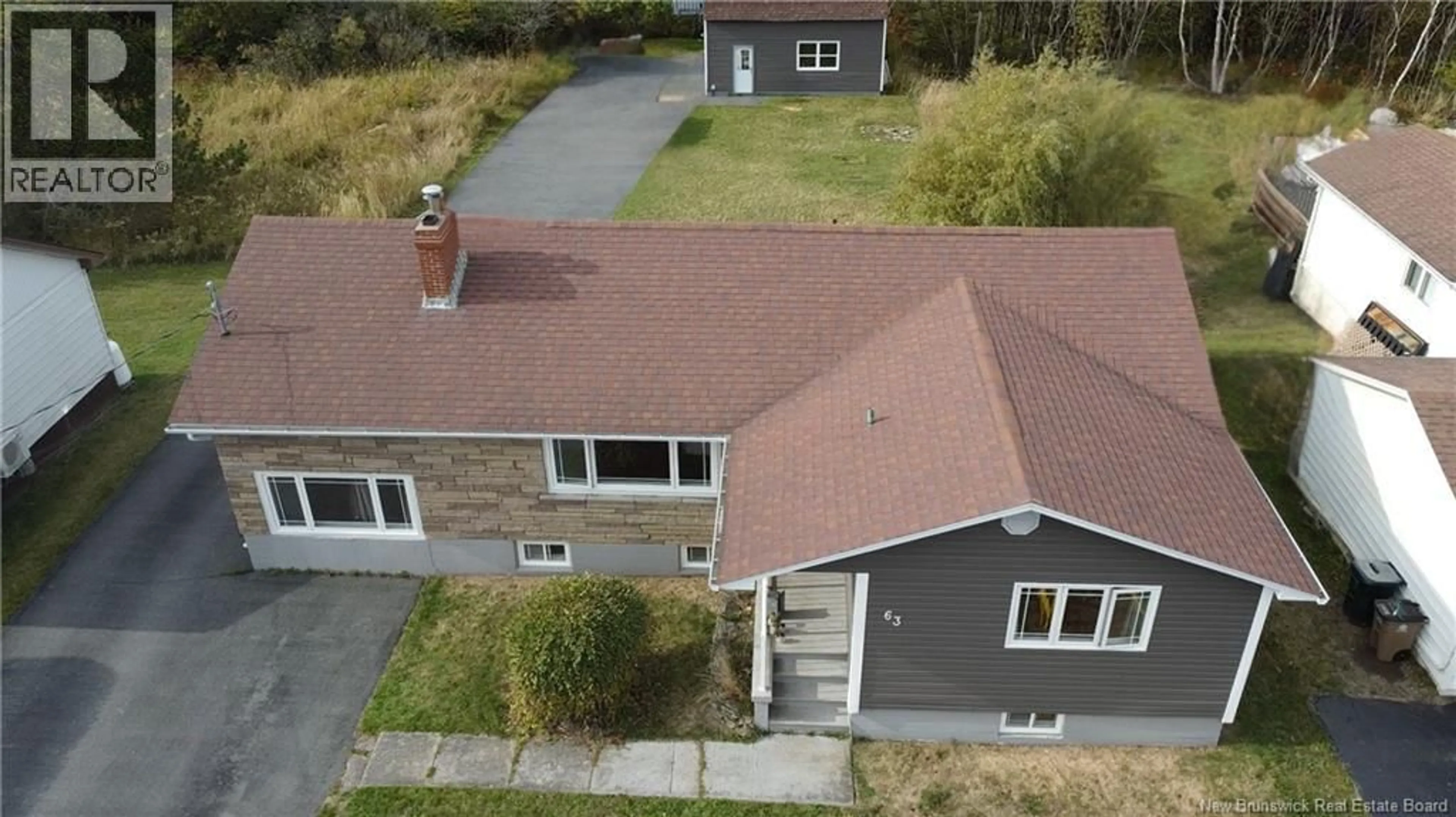 A pic from outside/outdoor area/front of a property/back of a property/a pic from drone, street for 63 BUENA VISTA AVENUE, Saint John New Brunswick E2M2S7